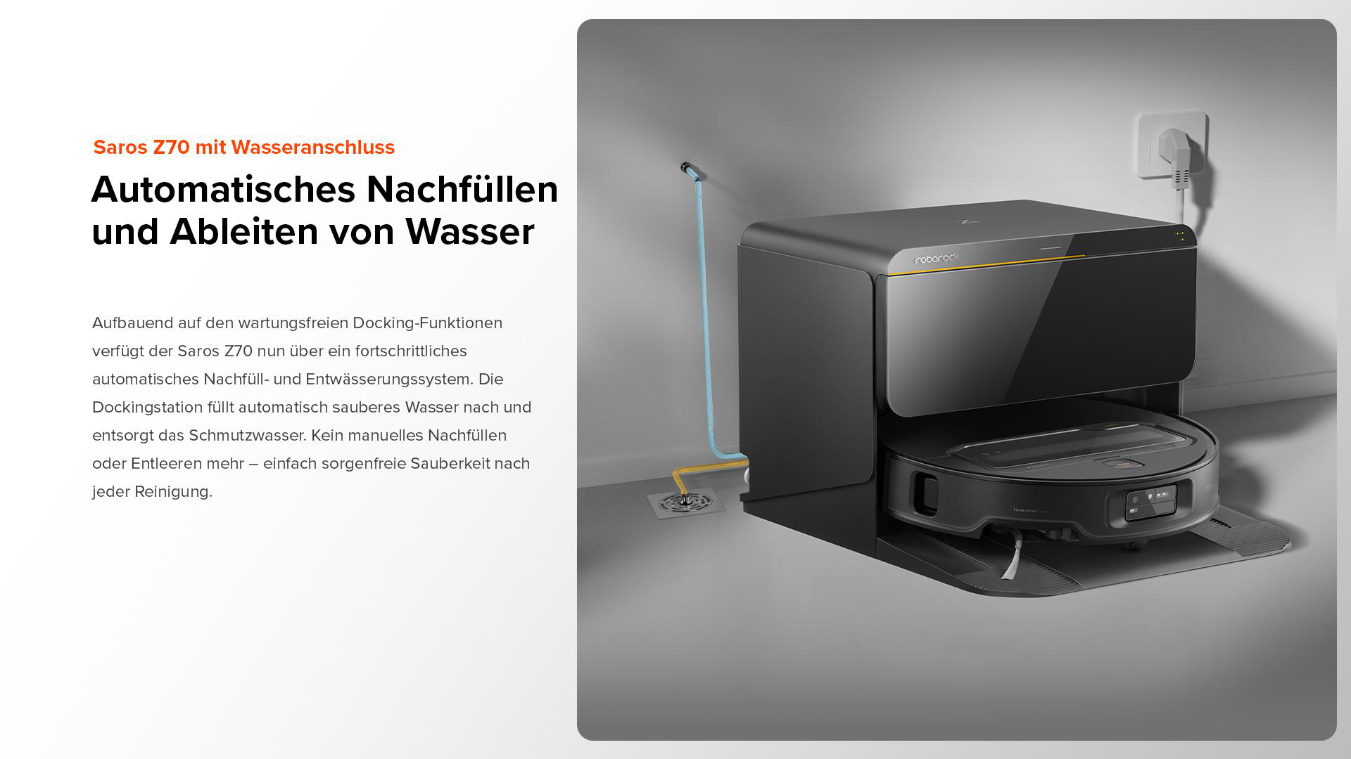 Eine schwarze Reinigungsstation mit einem Roboter-Staubsauger darin. Eine Wasser- und Stromleitung sind sichtbar.