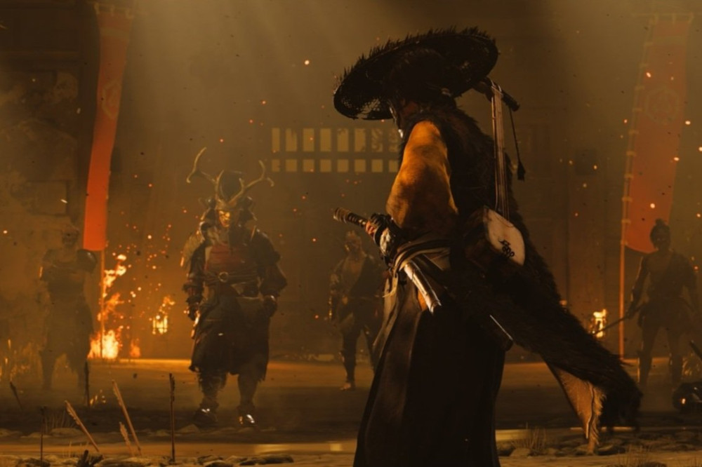 A samurai with a straw hat faces other warriors. The scene is filled with warm light, suggesting a battle. Fire and sparks are visible.