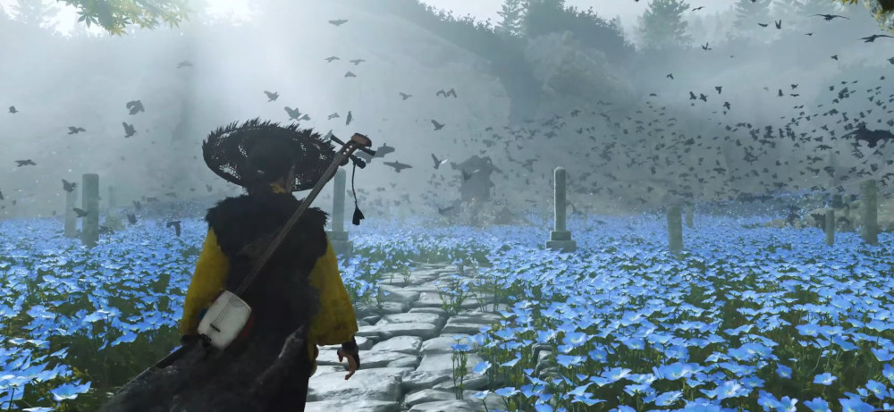 A person with a hat and instrument walks a stone path through blue flowers. Birds fly in a foggy, misty environment.