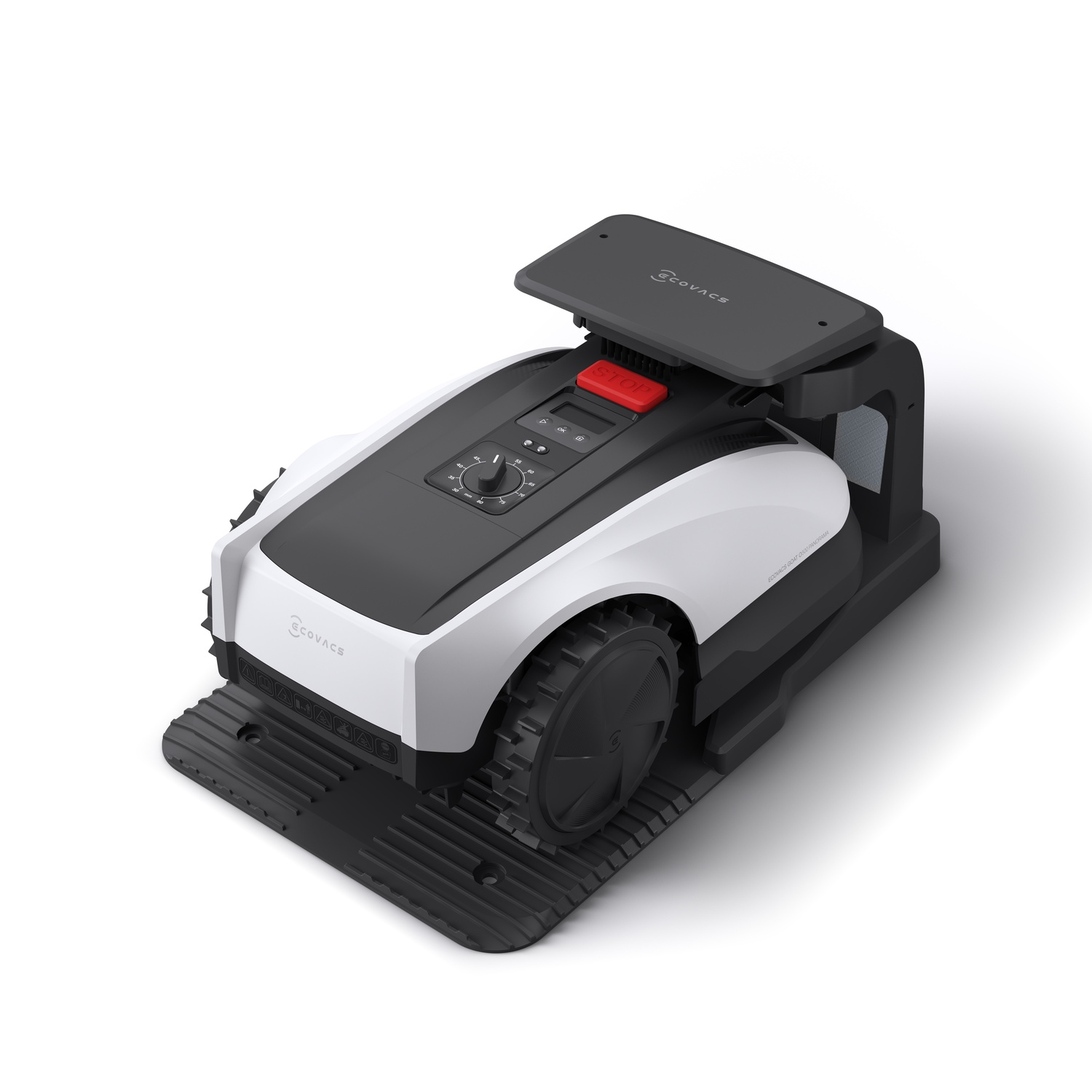 Un tosaerba robotico bianco e nero con un pulsante di arresto rosso, su una base nera. Lo sfondo è bianco.
