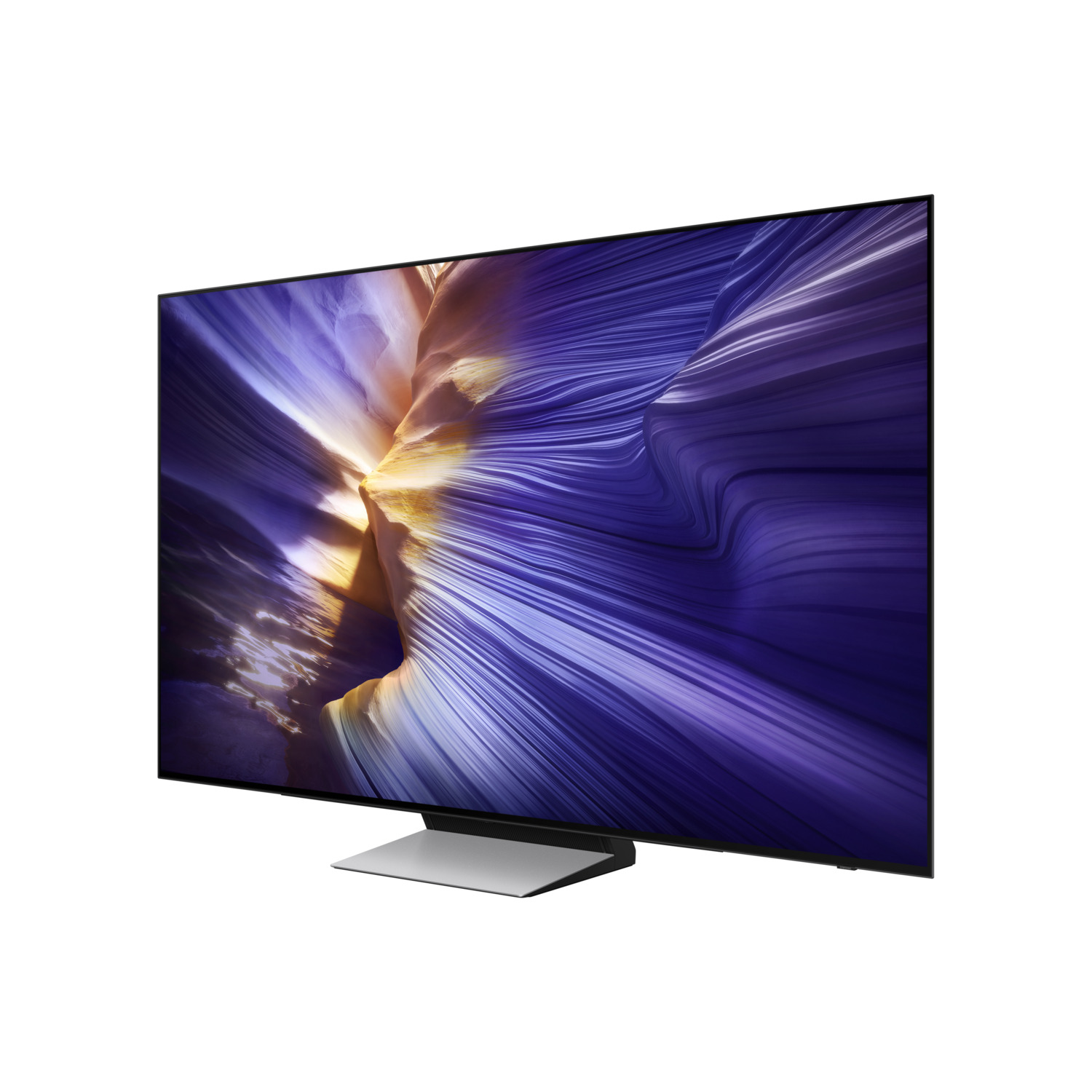 A modern TV with a large screen displays a colorful abstract image. It stands on a silver stand against a white background.