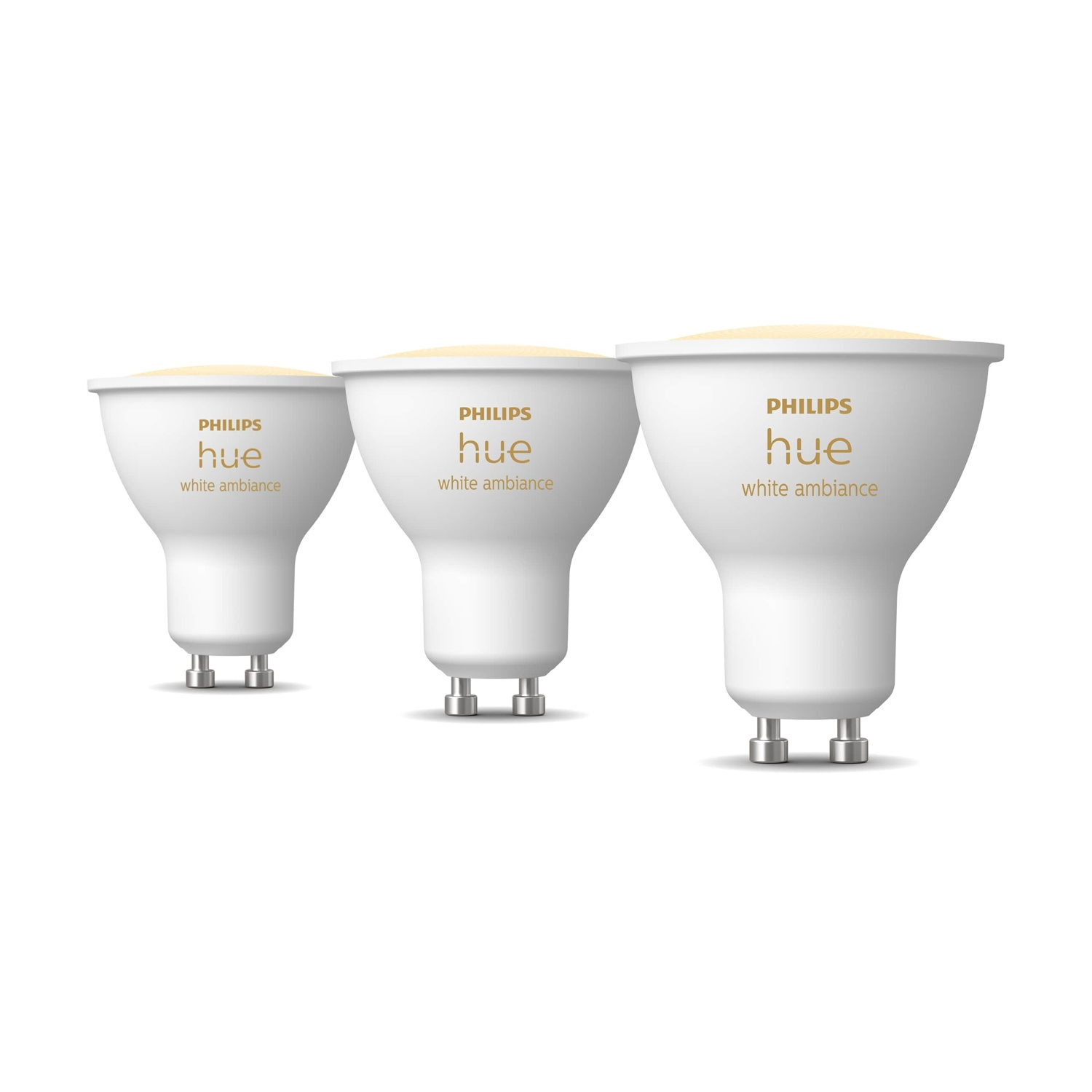 Tre lampadine bianche Philips Hue, ciascuna con la scritta "Philips Hue white ambiance", disposte su uno sfondo bianco.