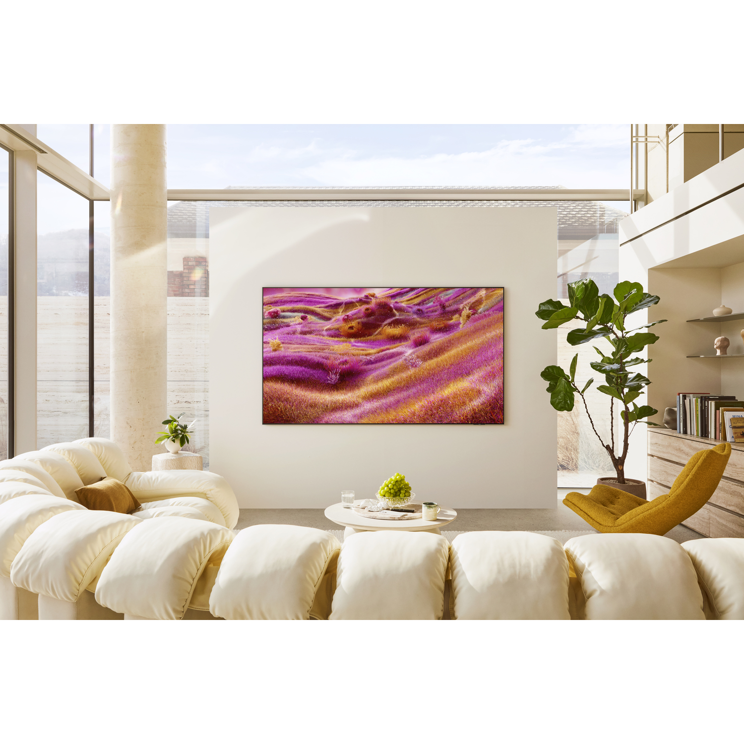 A TV showing a colorful abstract image in a bright living room. Plants and furniture.