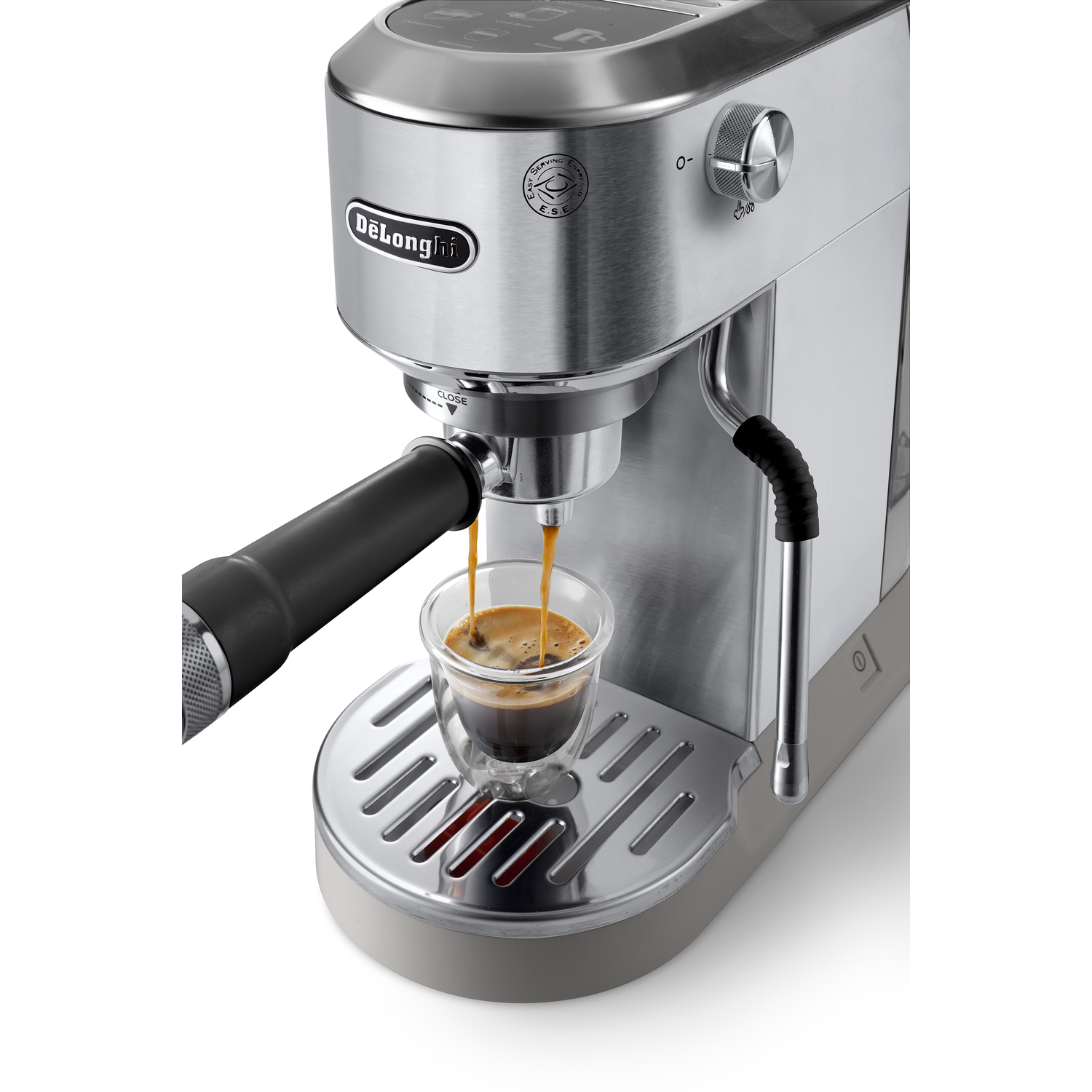 Close-up of an espresso machine pouring espresso into a glass. The background is white.