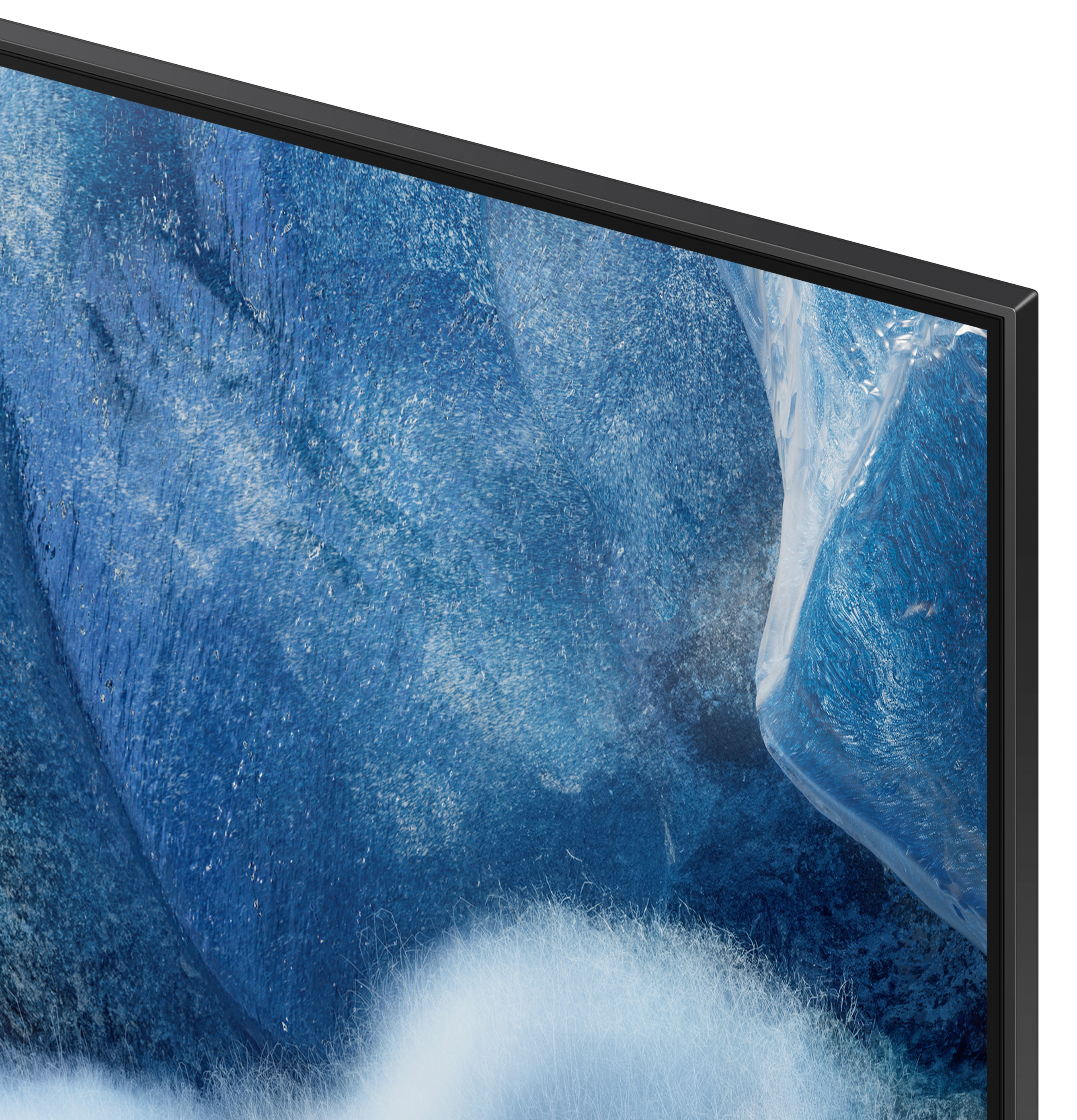 Zbliżenie lewego górnego rogu czarnego telewizora, wyświetlającego niebieski obraz.