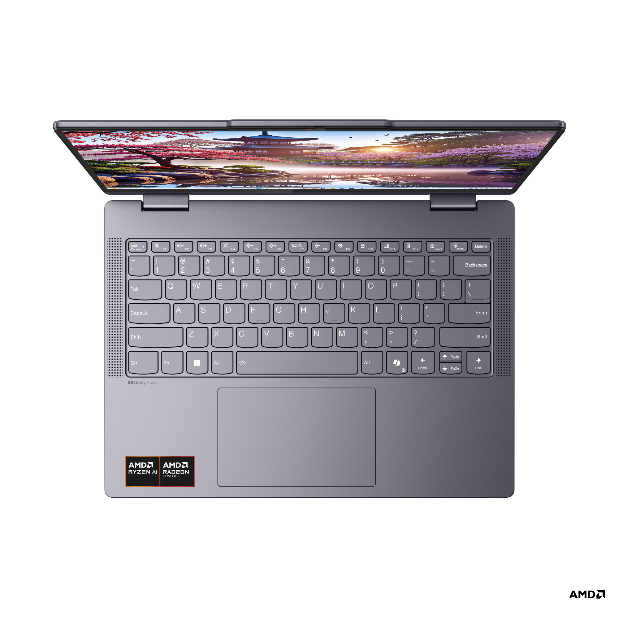 Manzara gösteren açık ekranlı koyu gri laptop. Klavye görünür. Siyah arka plan.