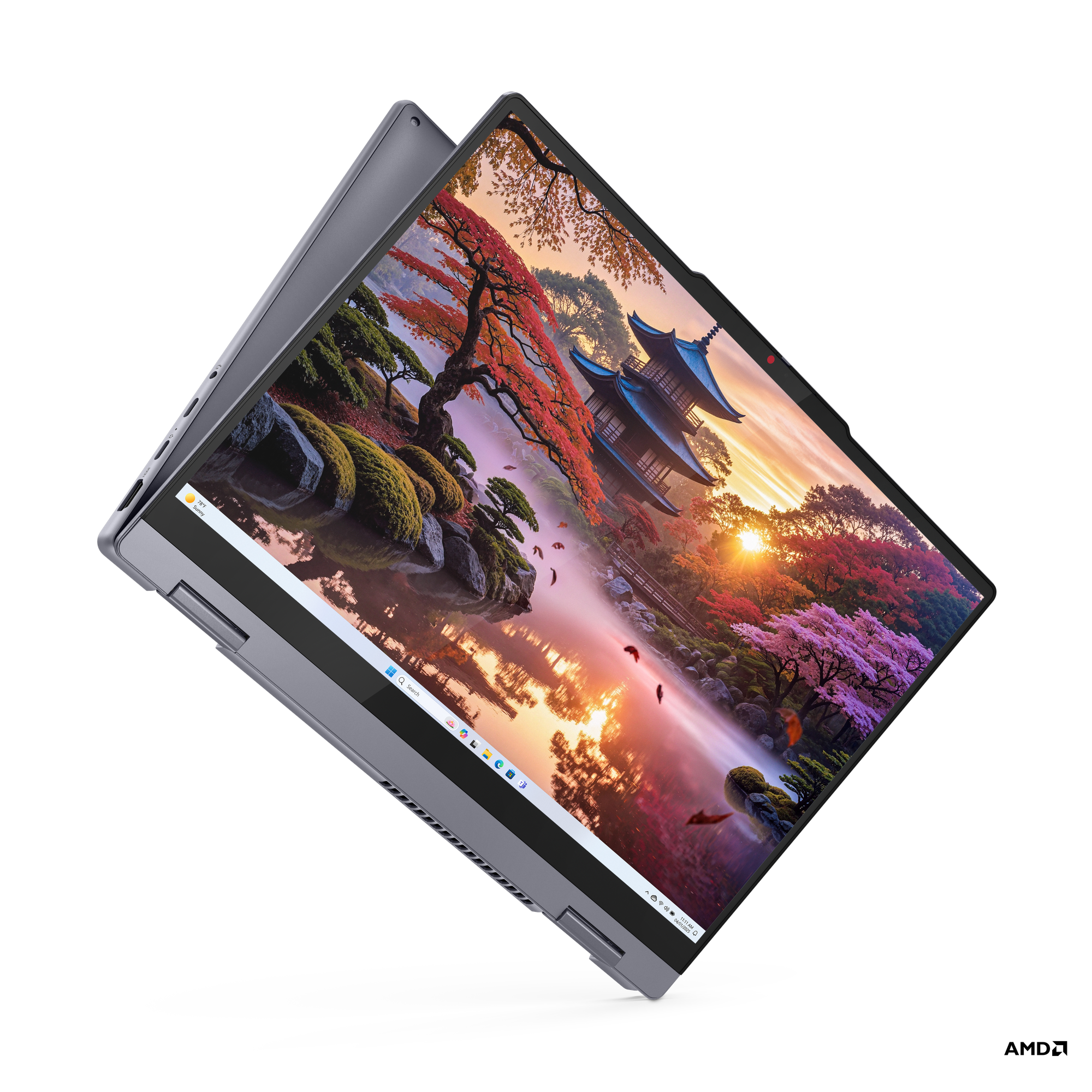 Manzara gösteren açık ekranlı koyu gri laptop. Siyah arka plan.