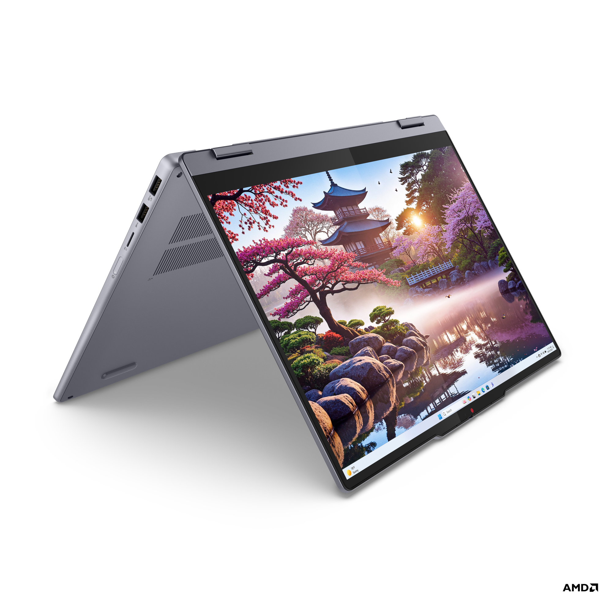Manzara gösteren açık ekranlı koyu gri laptop. Siyah arka plan.