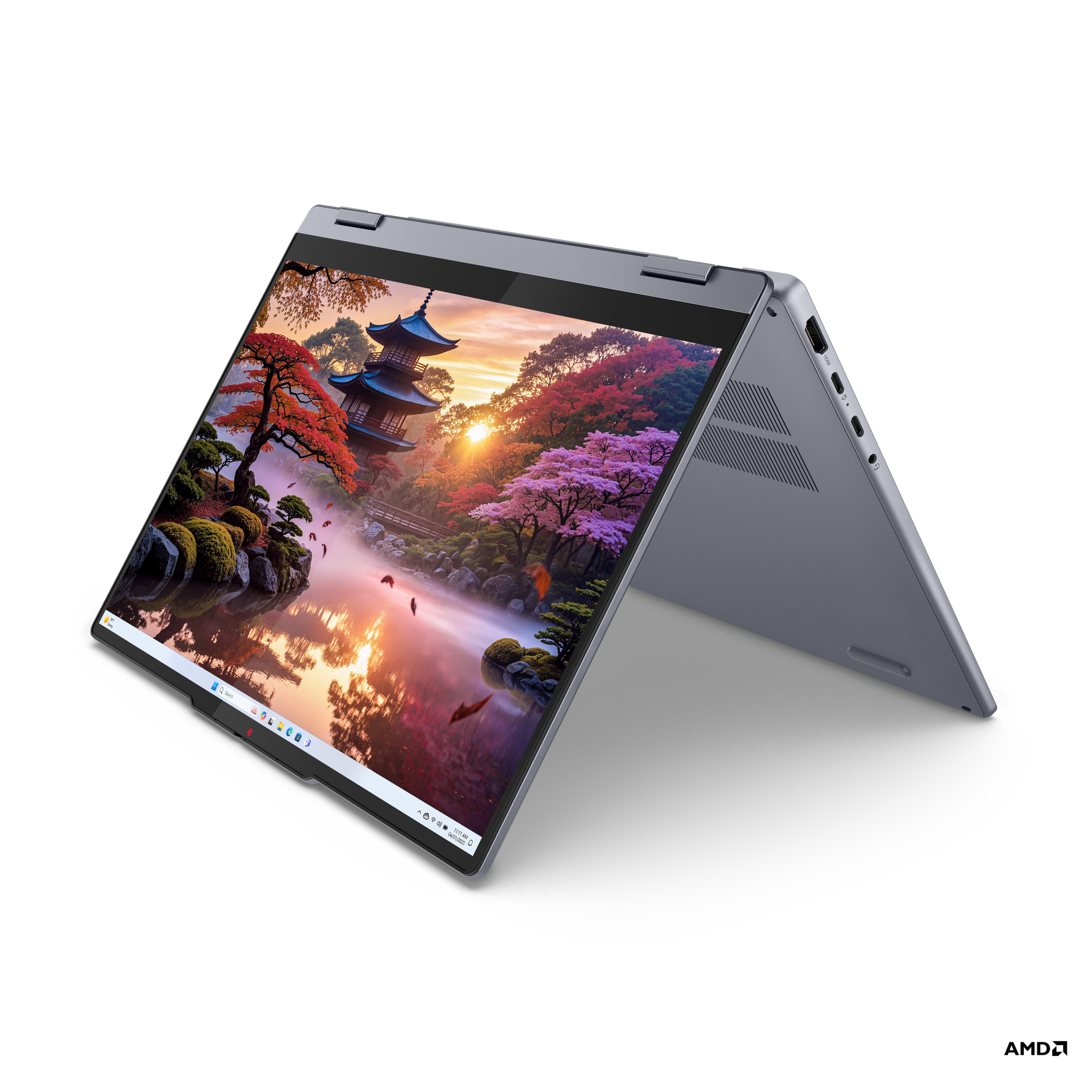 Manzara gösteren açık ekranlı koyu gri laptop. Siyah arka plan.