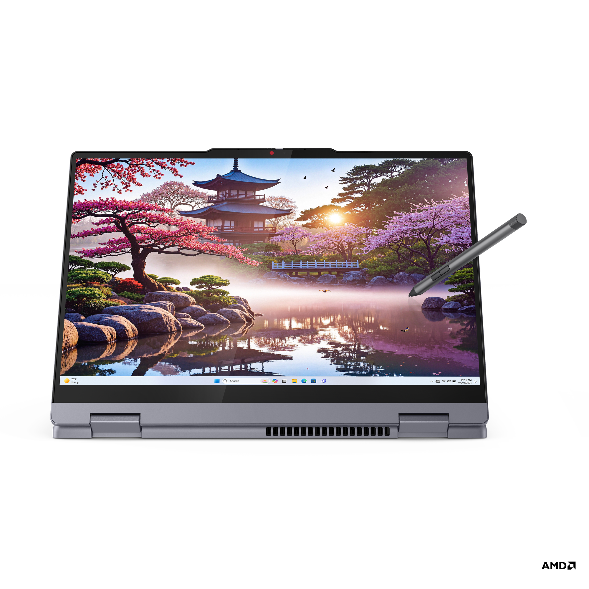 Manzara gösteren açık ekranlı koyu gri laptop. Yanında kalem. Siyah arka plan.