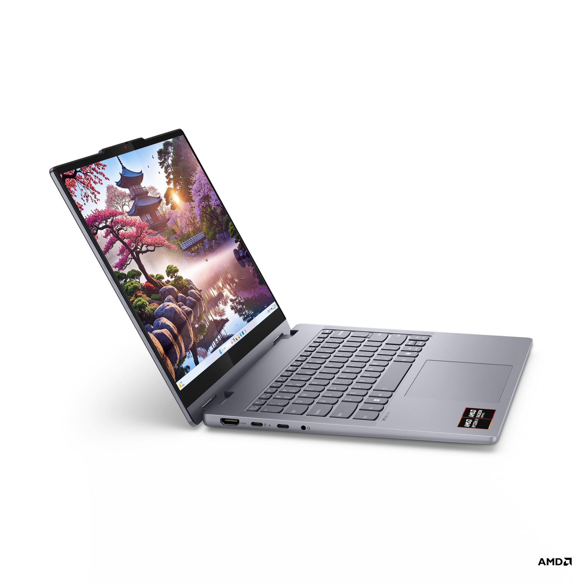 Manzara gösteren açık ekranlı koyu gri laptop. Siyah arka plan.