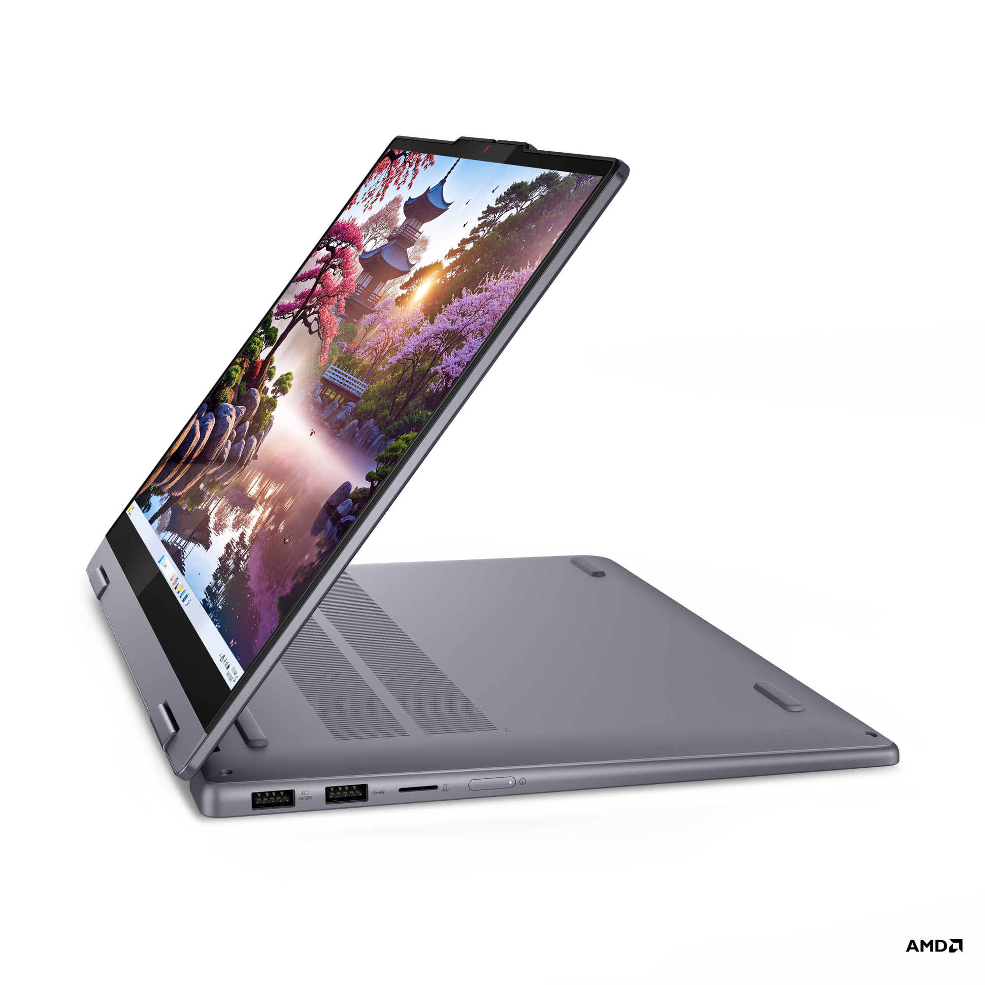 Manzara gösteren açık ekranlı koyu gri laptop. Siyah arka plan.