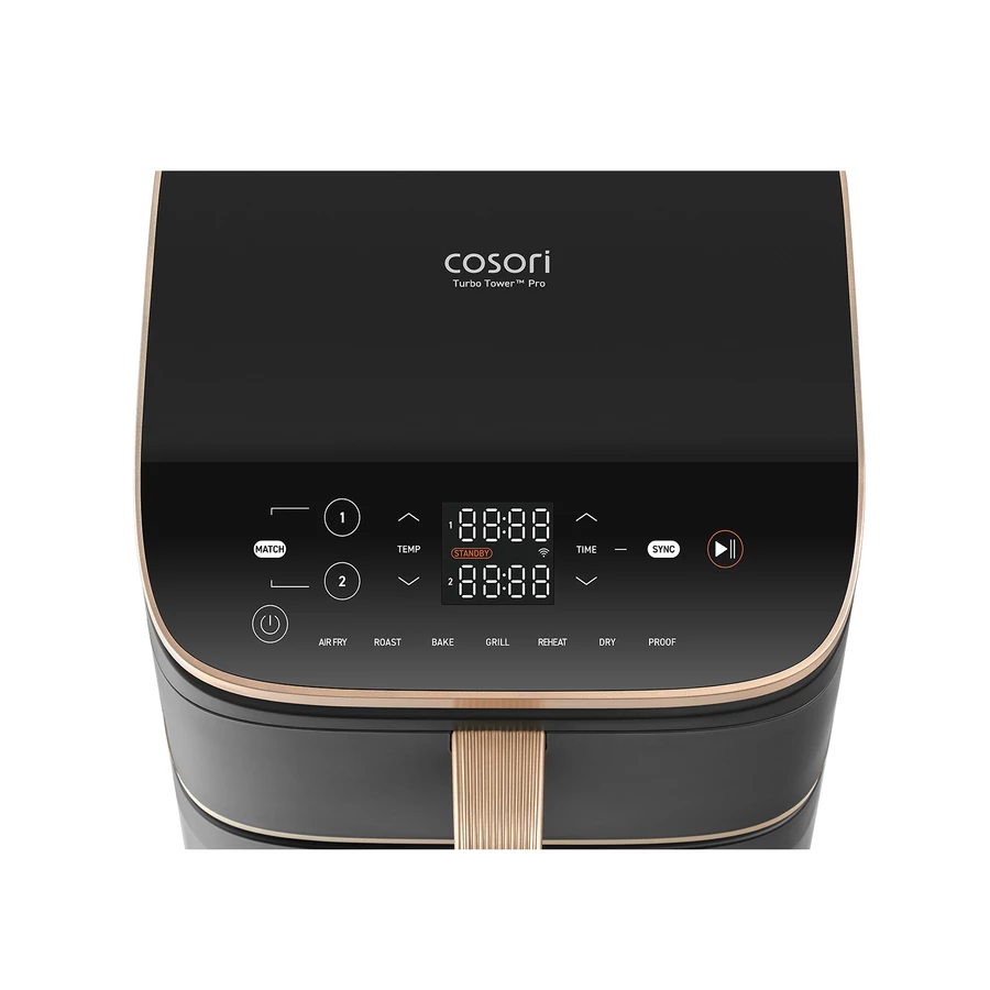 Közeli kép egy fekete Cosori Turbo Tower Pro légkeveréses sütő vezérlőpaneléről, arany díszítéssel.