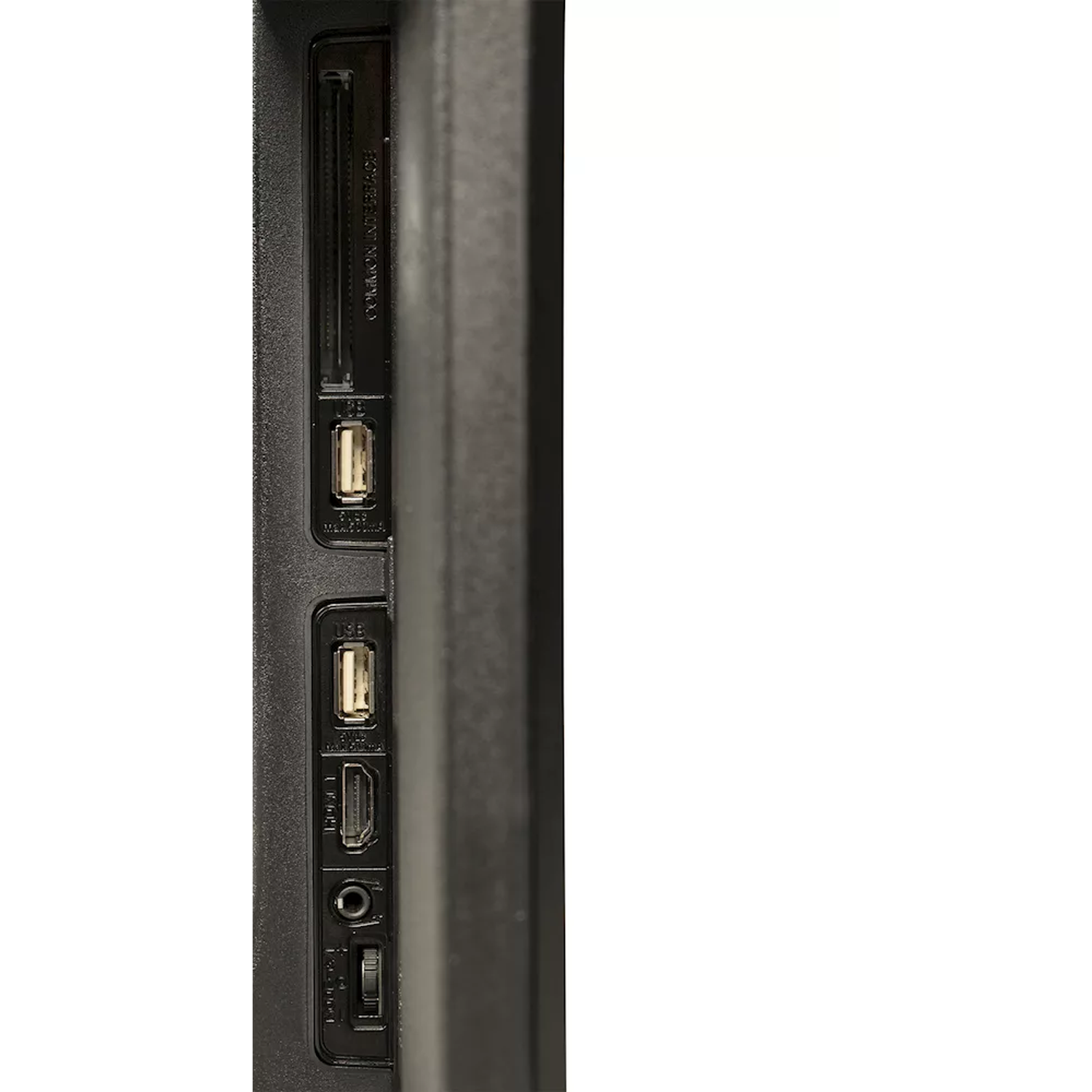 Close-up of TV back with ports: USB, HDMI, audio, antenna, etc.