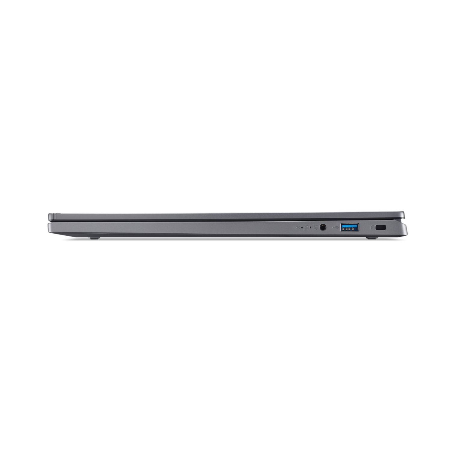 Side view of a closed gray laptop. Ports visible: USB, audio, power, and others. White background.