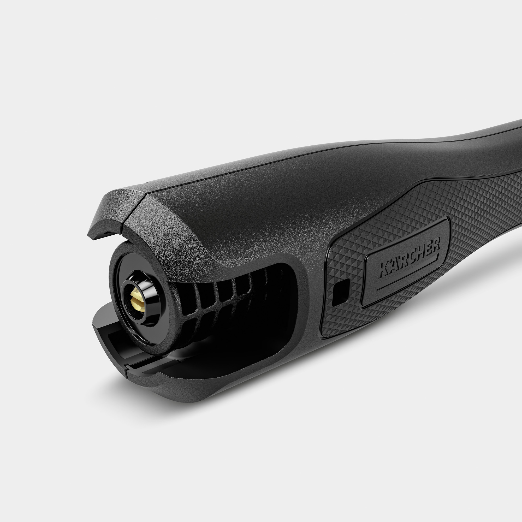 Zbliżenie czarnej dyszy myjki ciśnieniowej ze złotym detalem.