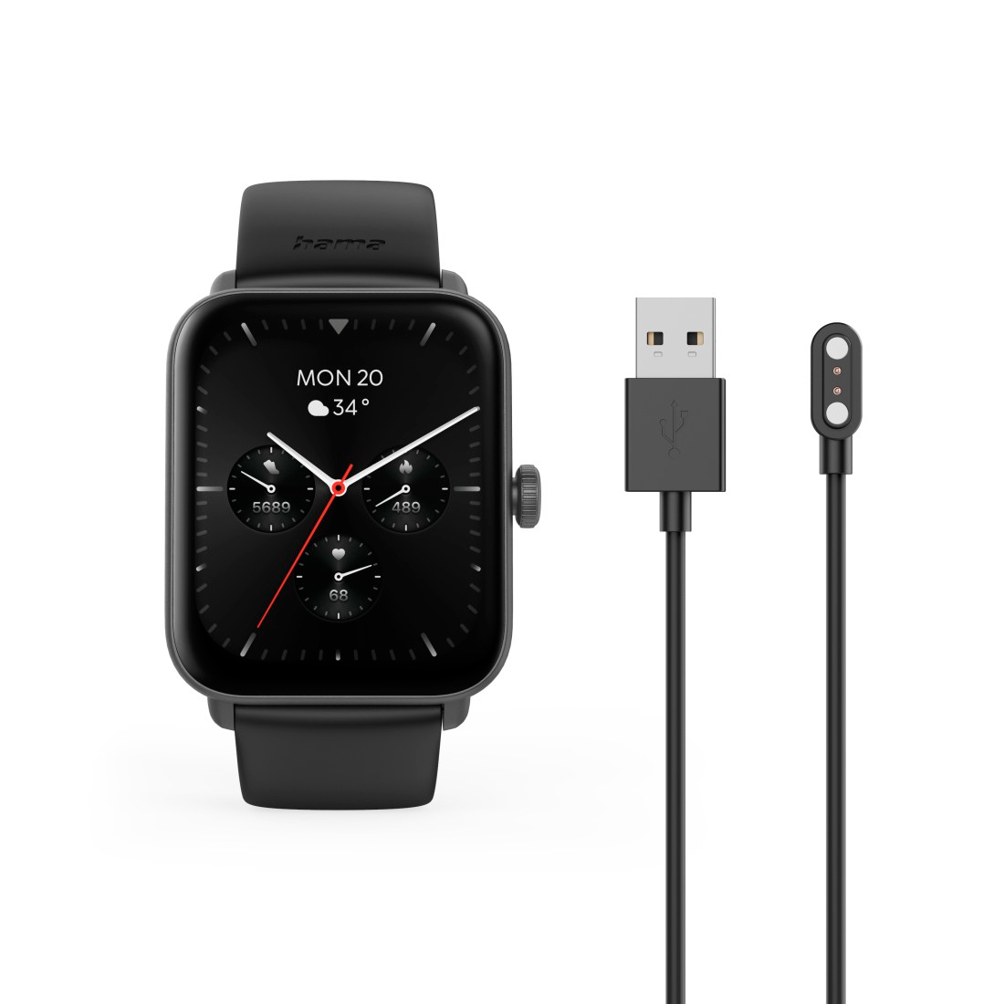 Egy fekete okosóra, amely az időt és a számlapot jeleníti meg, egy USB töltőkábel és egy töltőpad mellett.