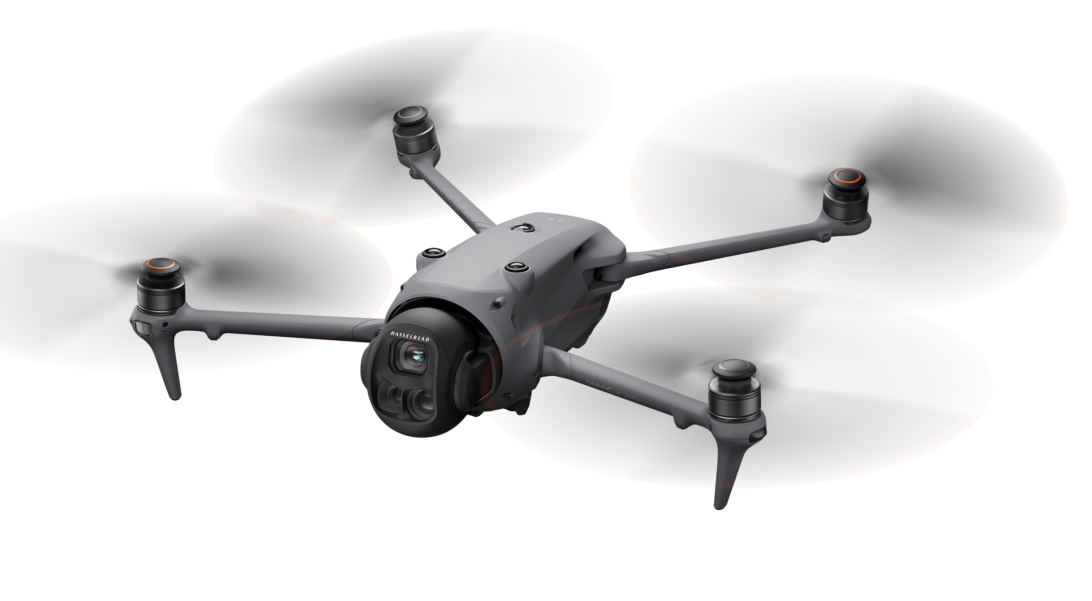 Dron z wirującymi śmigłami, białe tło.