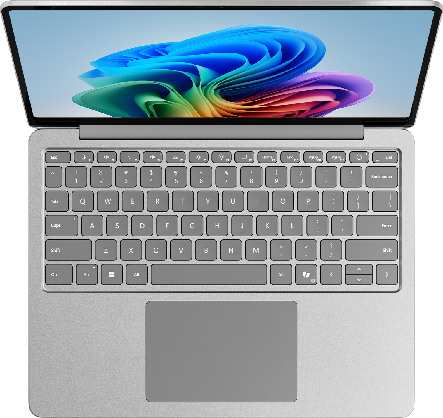 Draufsicht auf einen silbernen Laptop mit geöffnetem Bildschirm und Tastatur.