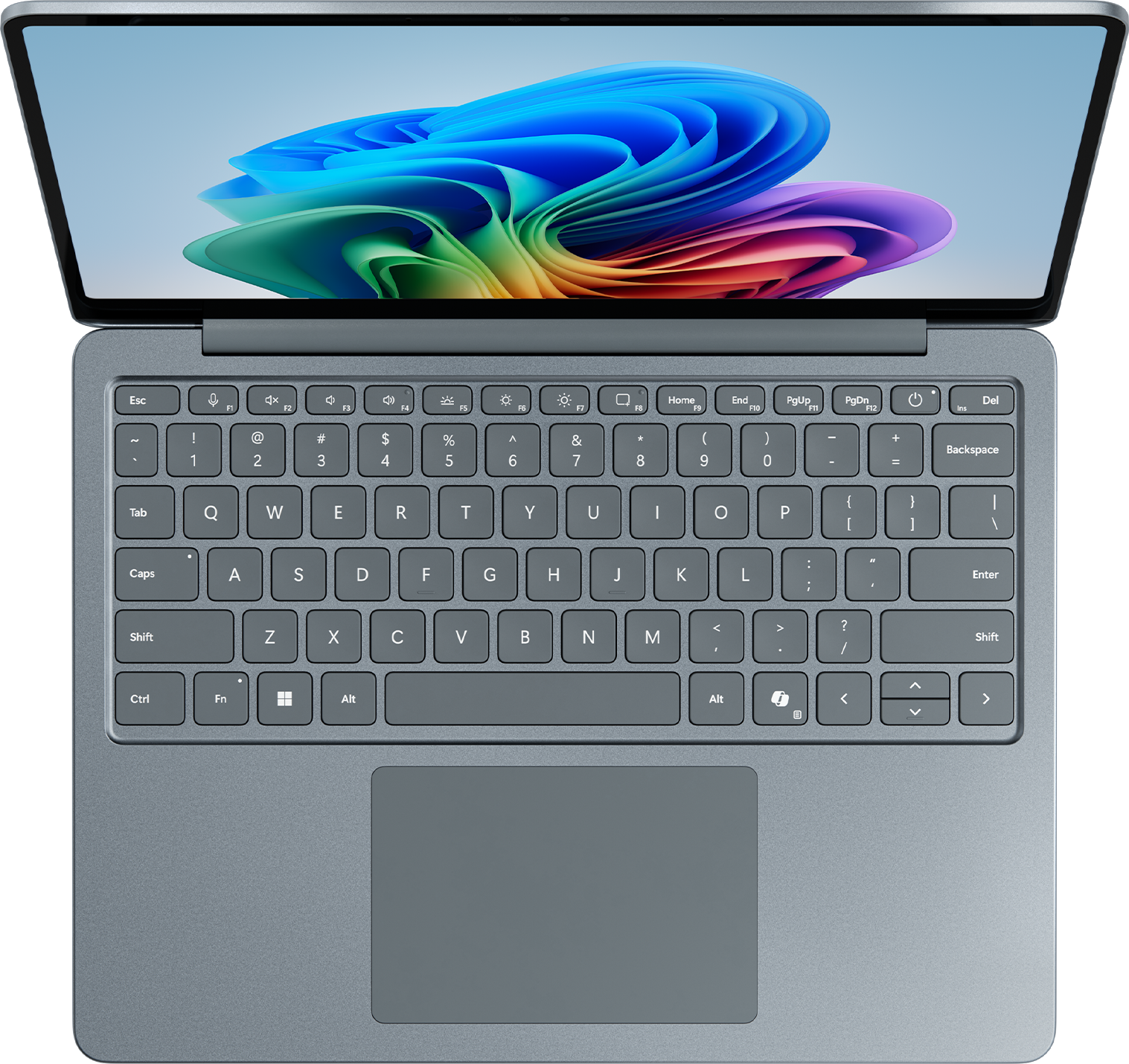 Vue de dessus d'un ordinateur portable argenté avec écran ouvert et clavier. Fond noir.