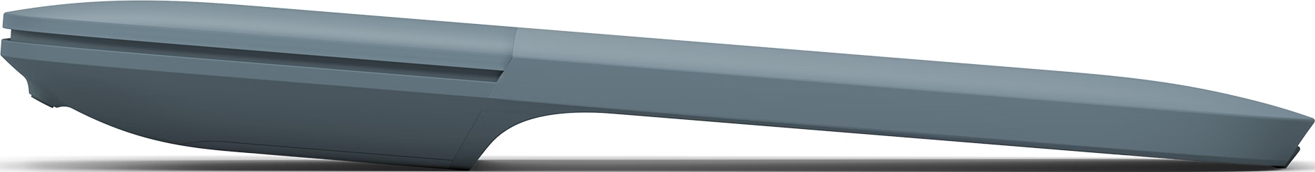 Un objet gris angulaire, possiblement une pièce de voiture, sur fond blanc. L'objet est lisse, avec des bords définis et des ombres subtiles.