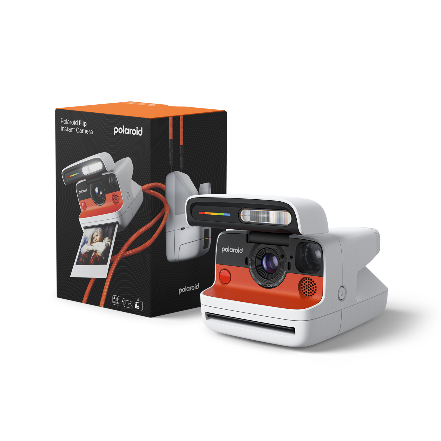 A white and orange Polaroid instant camera with its box. The box is black and orange, showing the camera and a photo.