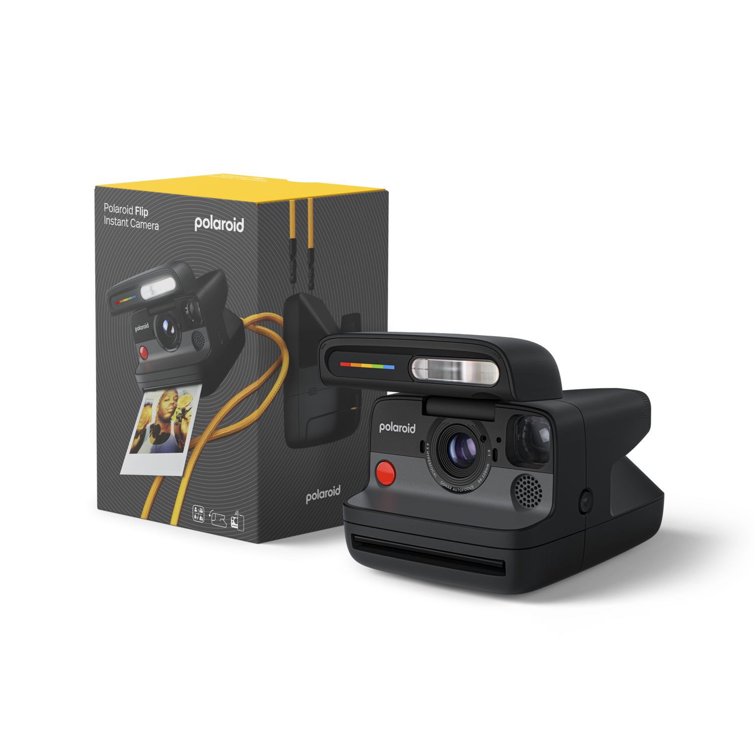 Un appareil photo instantané Polaroid noir est à côté de sa boîte. La boîte montre un autre appareil photo et une photo. L'appareil photo a un bouton rouge.