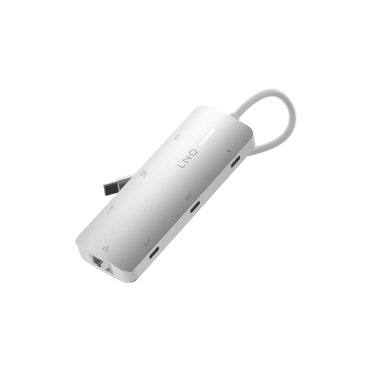 Concentrador USB-C plateado con múltiples puertos sobre fondo negro, vista en ángulo.