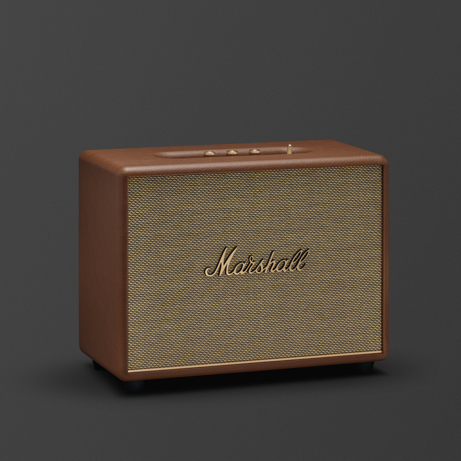 Altoparlante Marshall marrone su sfondo grigio scuro. Griglia beige e scritta Marshall dorata.