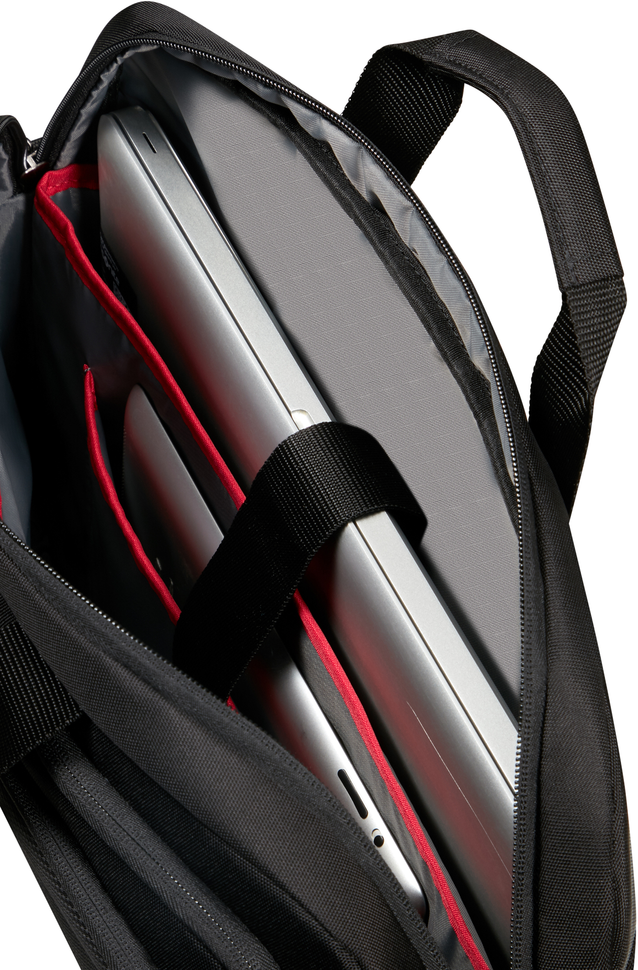 Czarna teczka otwarta, pokazująca laptopy i tablety w środku, z widoczną czerwoną podszewką.