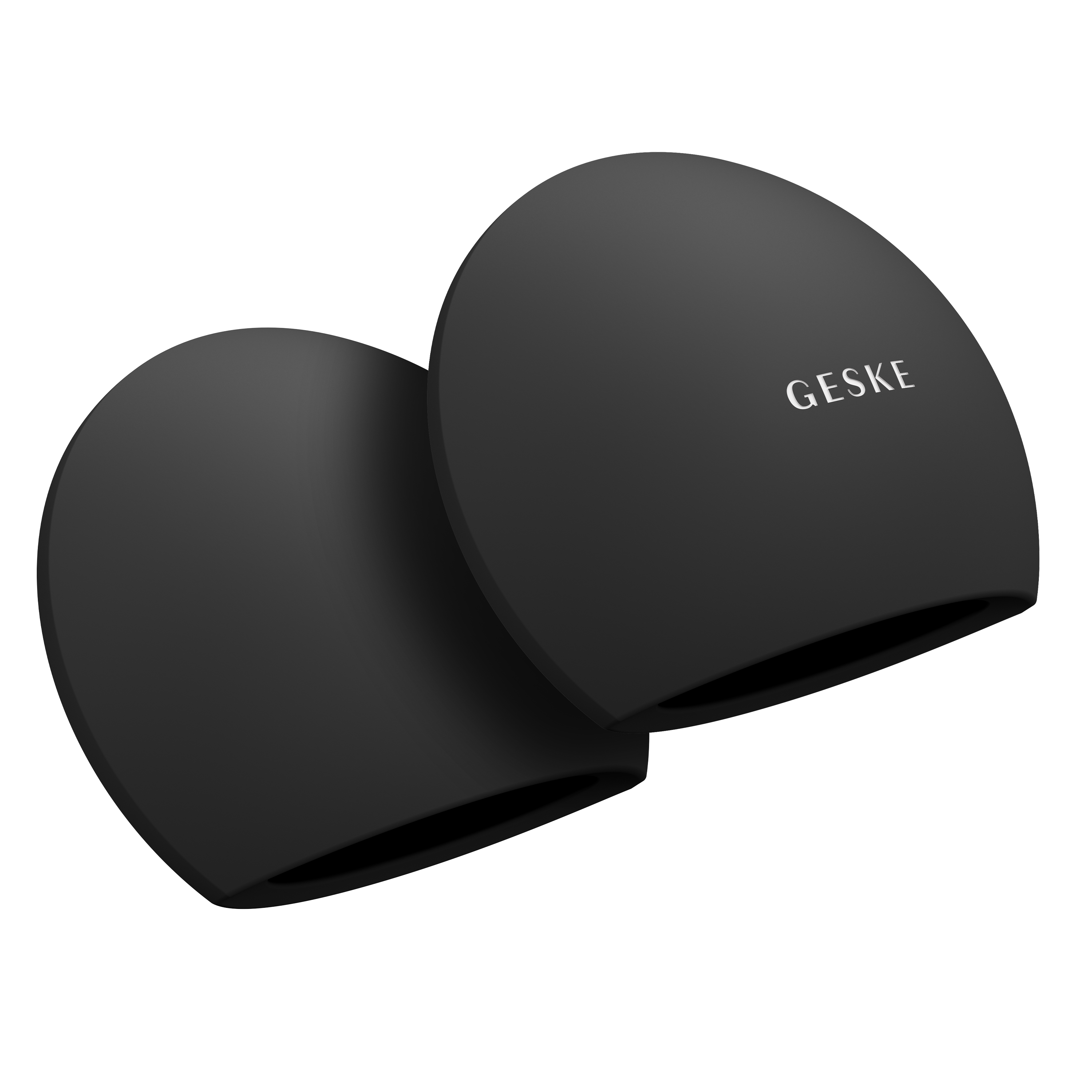 İki siyah Geske yüz temizleme cihazı. Siyah bir arka plan üzerinde yuvarlak tepelere sahip oval şekillidirler.