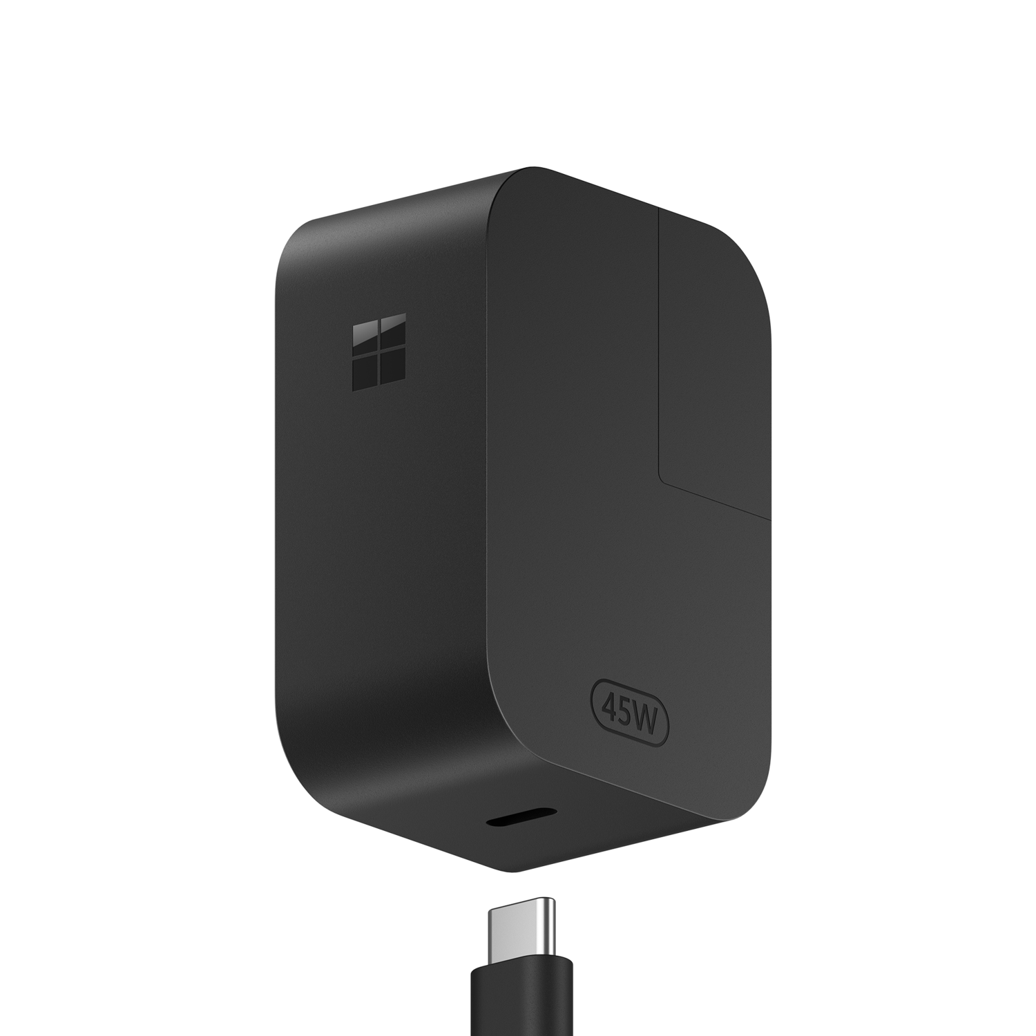 Zwarte Microsoft 45W-oplader met een USB-C-kabel op een zwarte achtergrond. De oplader heeft het Microsoft-logo.