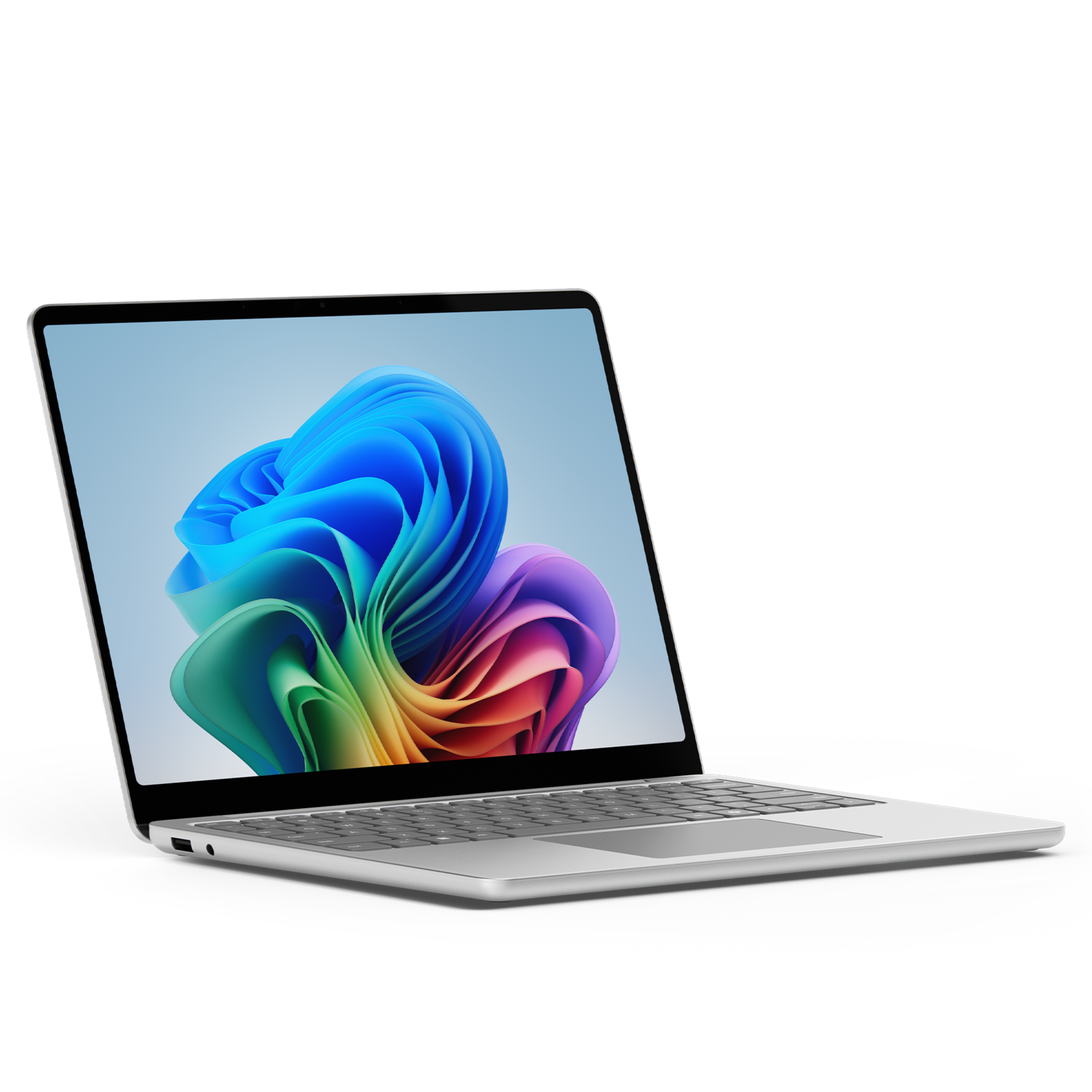 A silver laptop is open, displaying a colorful abstract image. The background is black.