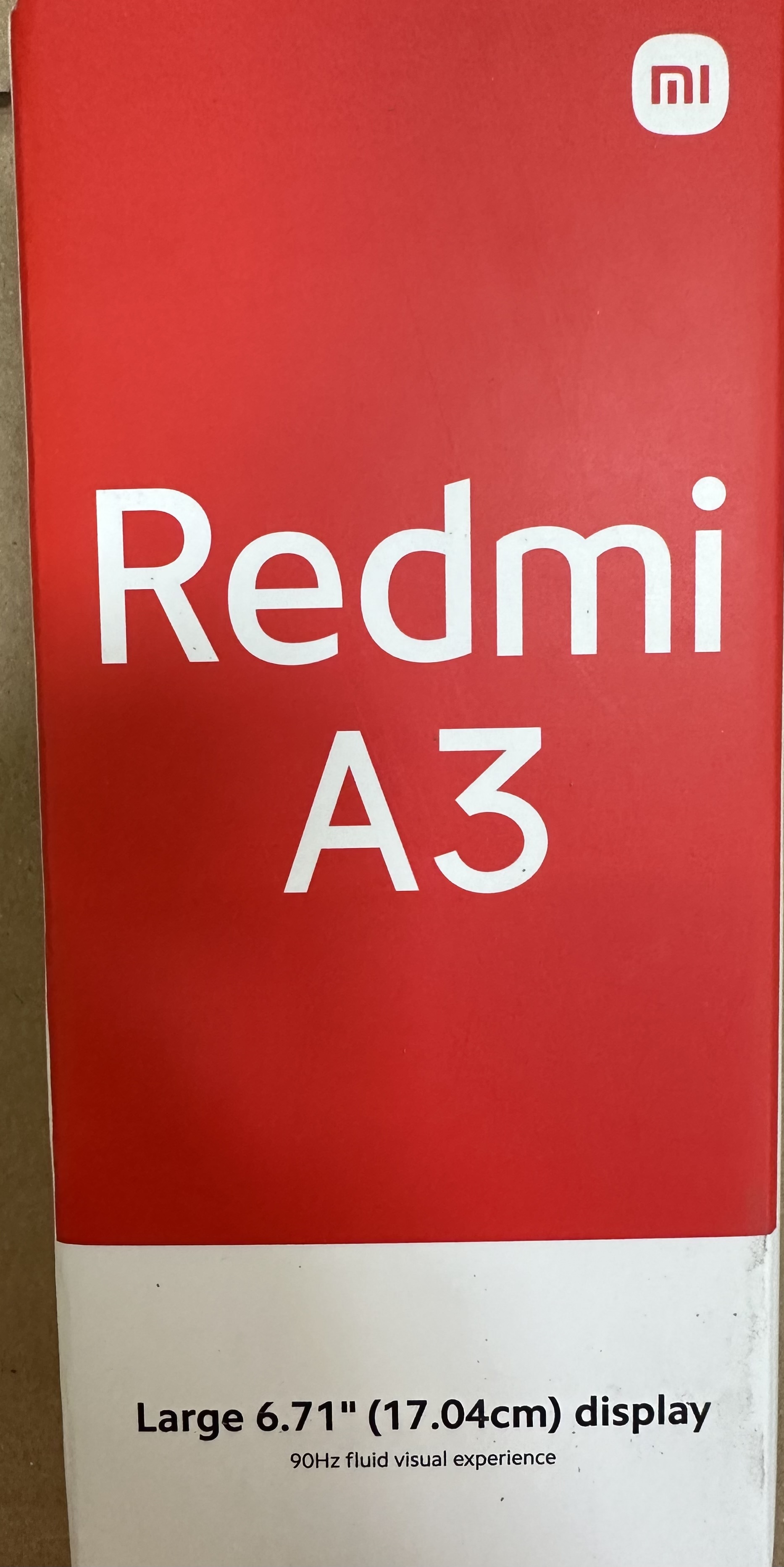 Pudełko Redmi A3, czerwone z białym tekstem i logo Xiaomi.