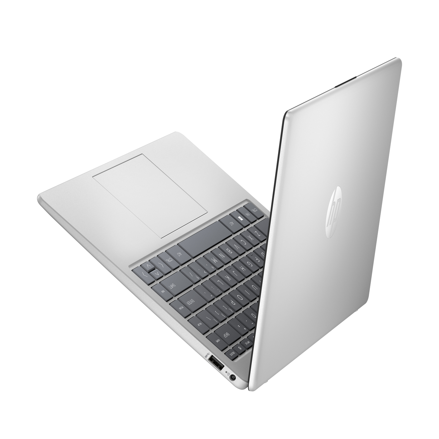 Silver laptop, open at an angle, keyboard visible. White background.
