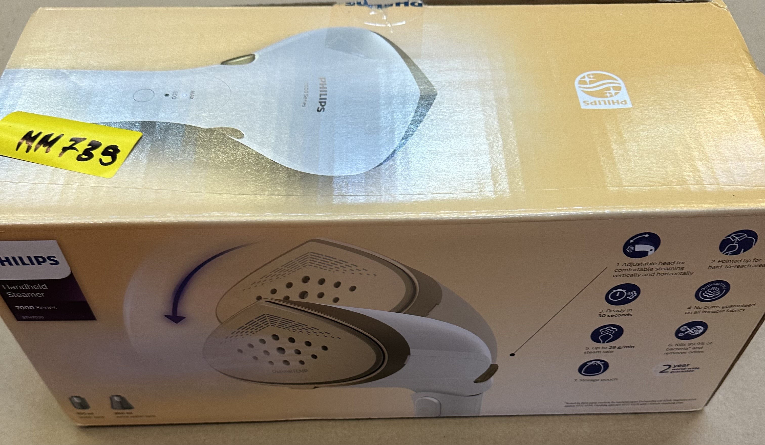 Pudełko parownicy ręcznej Philips, widoczna biała parownica i widoczny tekst.