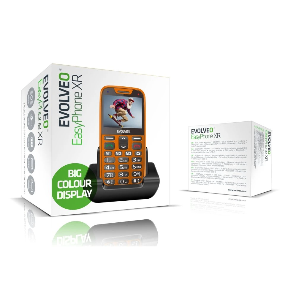 Dobozos narancssárga telefon fekete állvánnyal egy másik doboz előtt.