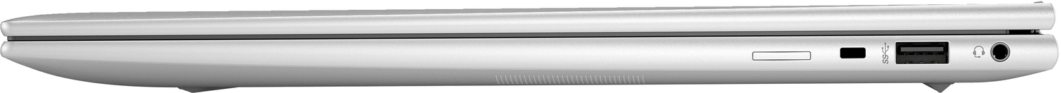 Laptop plateado, vista lateral. Muestra puertos, una ranura para tarjetas y una toma para auriculares.