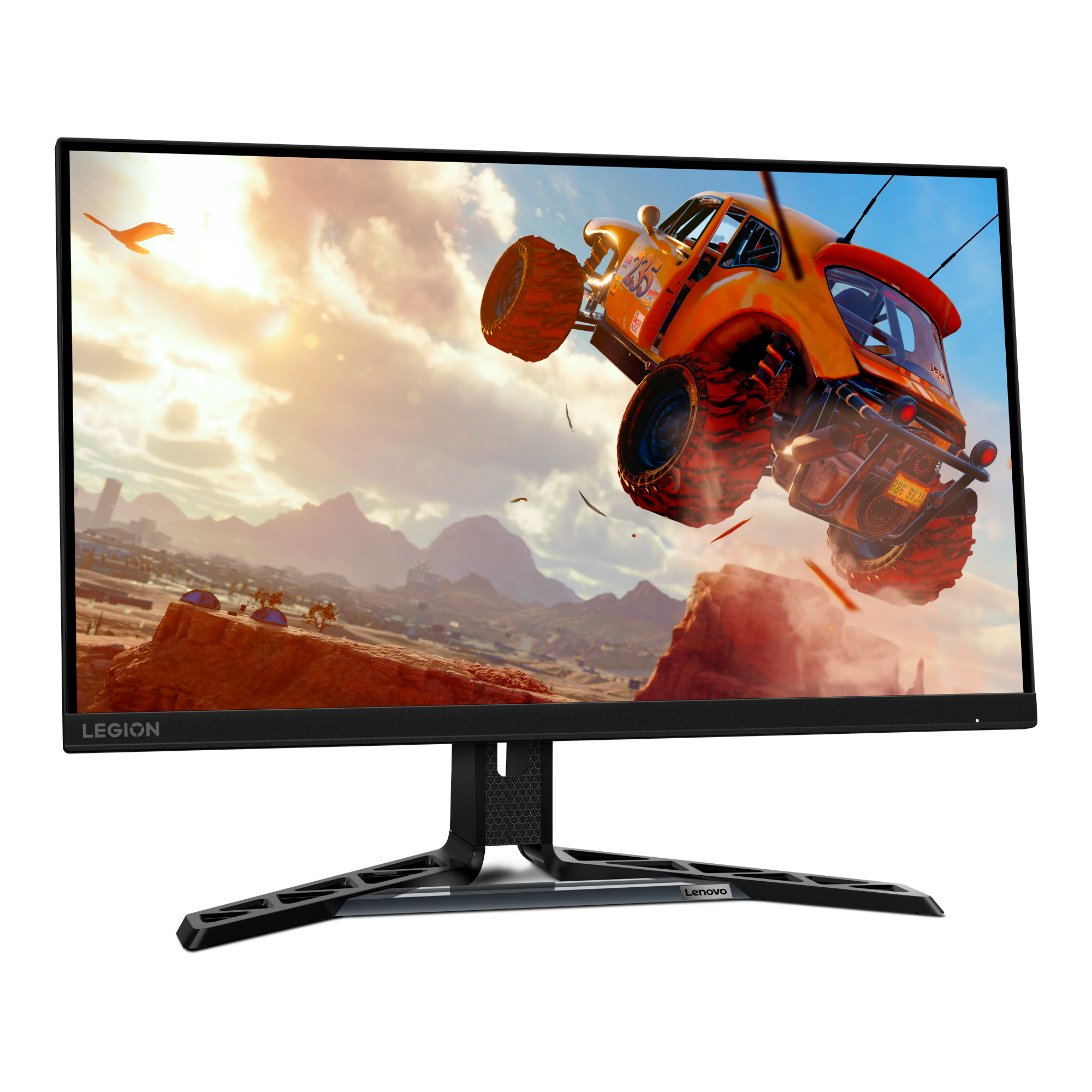 Bir Lenovo Legion monitör, çöl manzarasında zıplayan bir araba gösteriyor. Monitörün siyah çerçevesi ve standı var.