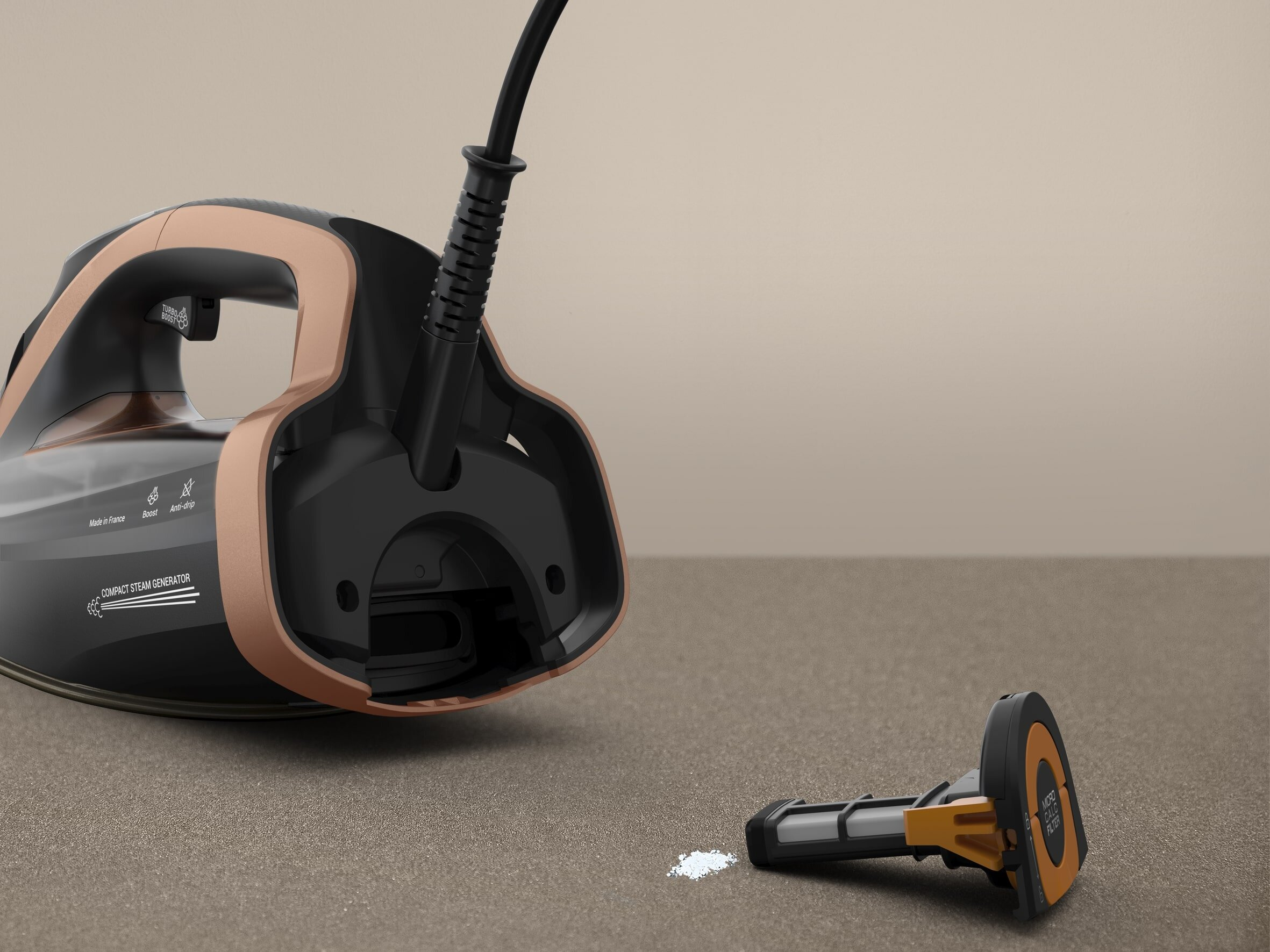 Podstawa żelazka z usuniętym filtrem, pokazująca wnętrze.