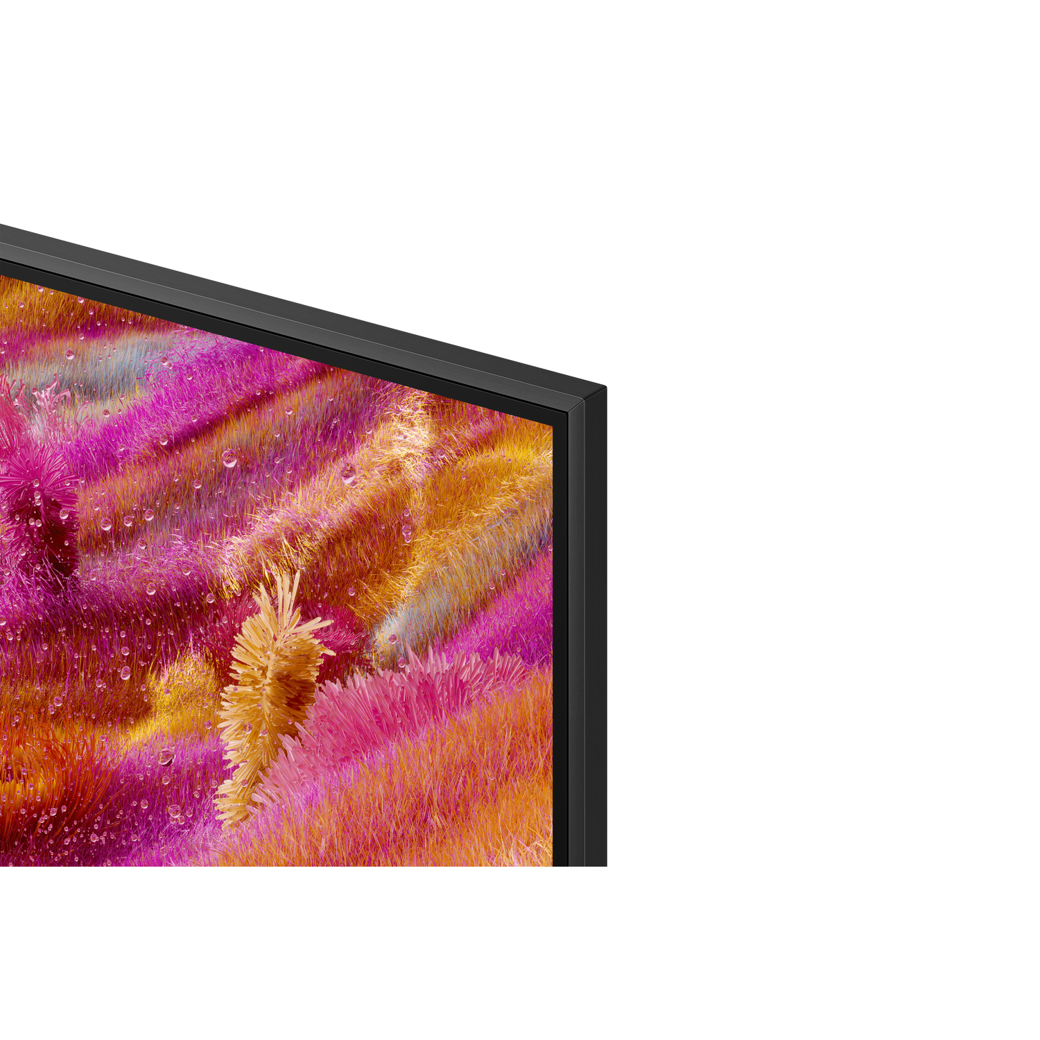 Close-up of a TV corner. The screen displays a colorful landscape. Black frame present.