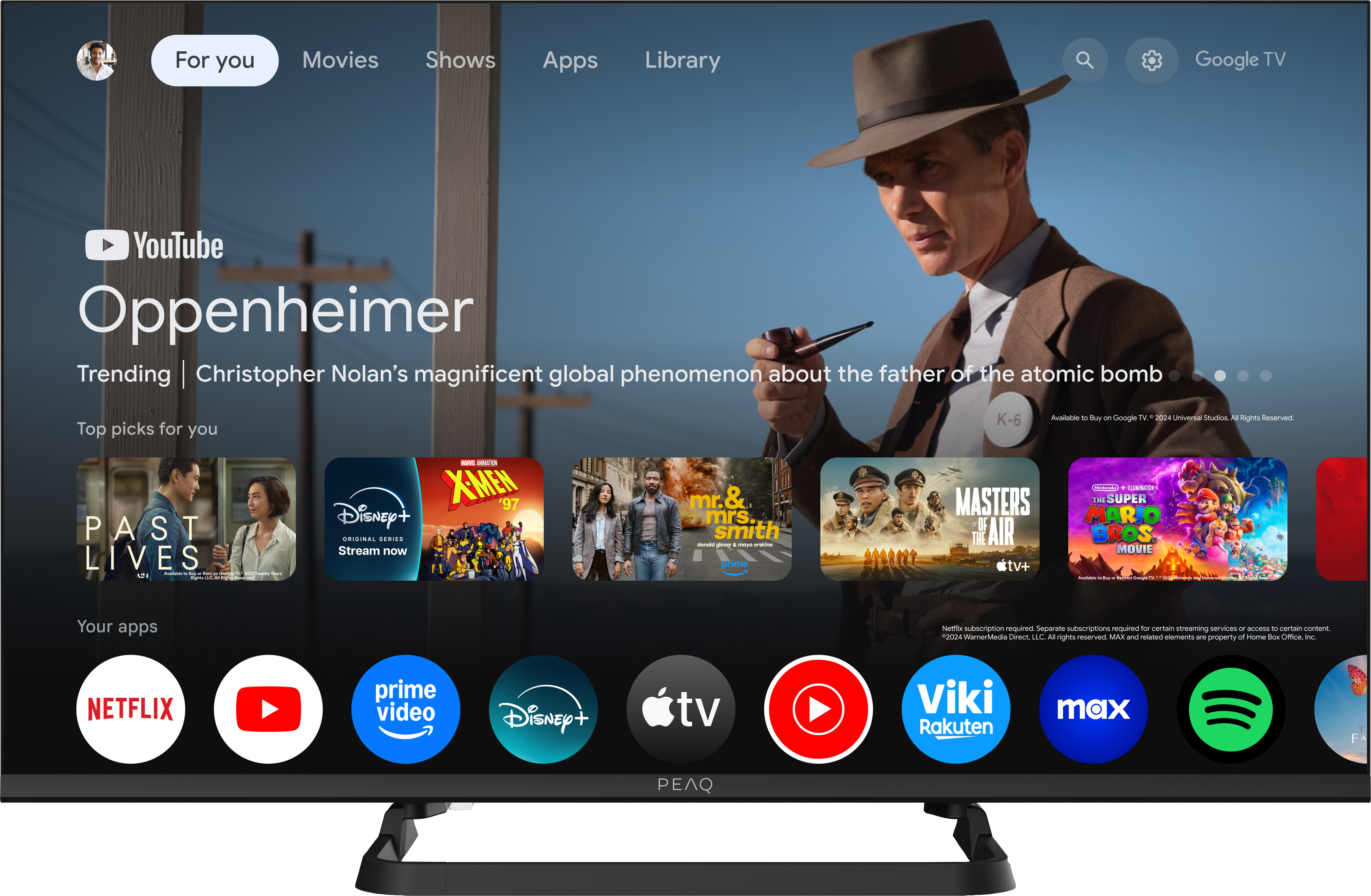 PEAQ-Fernseher zeigt Oppenheimer-Schnittstelle mit App-Symbolen.