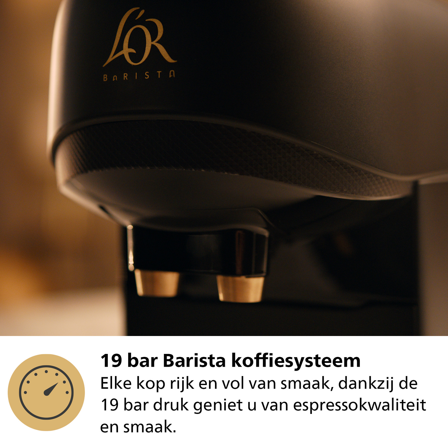 Coffee machine dispensing coffee into cups with gold accents.