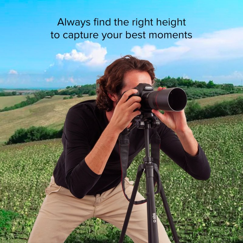 Mężczyzna robi zdjęcie aparatem na statywie na polu.