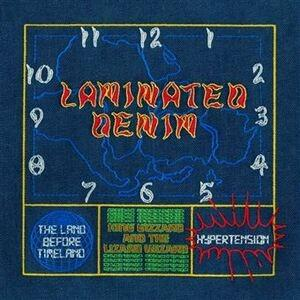 Albumcover mit gesticktem Text 'Laminated Denim' auf blauem Hintergrund, mit einem Uhrdesign.