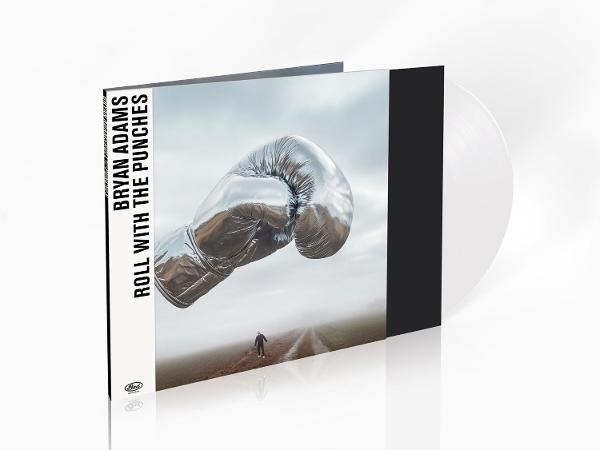Albumcover: Silberner Boxhandschuh über Straße, Person geht. Vinyl vorhanden.