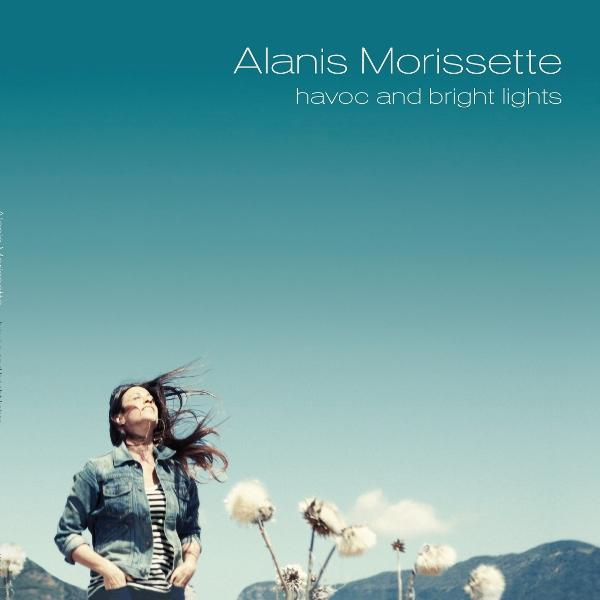 Albumcover: Frau schaut hoch, Blumen, blauer Himmel. Text: Alanis Morissette, havoc and bright lights.
