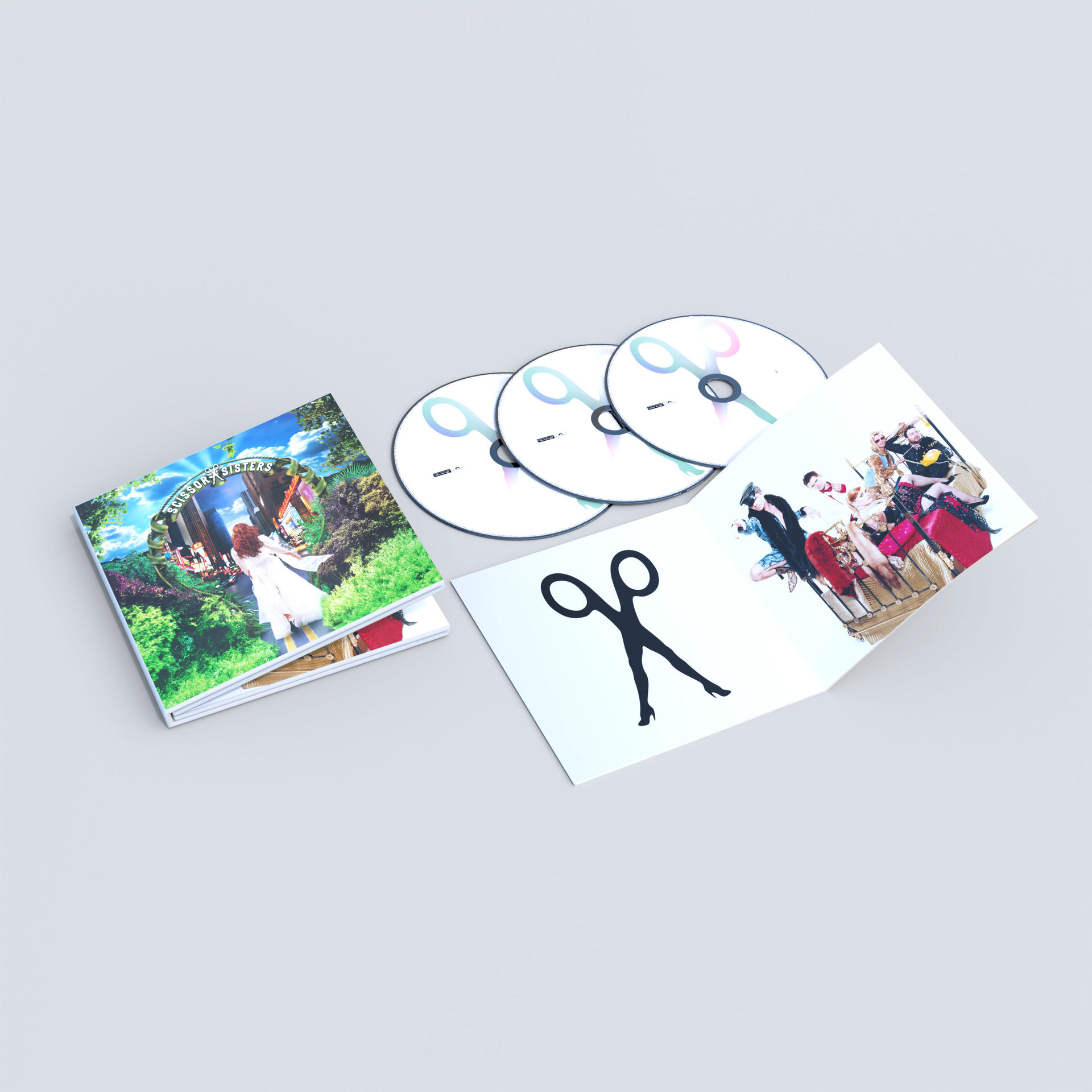 Album cover, three CDs, and an open booklet. The cover shows a woman in a field, the CDs have a logo.
