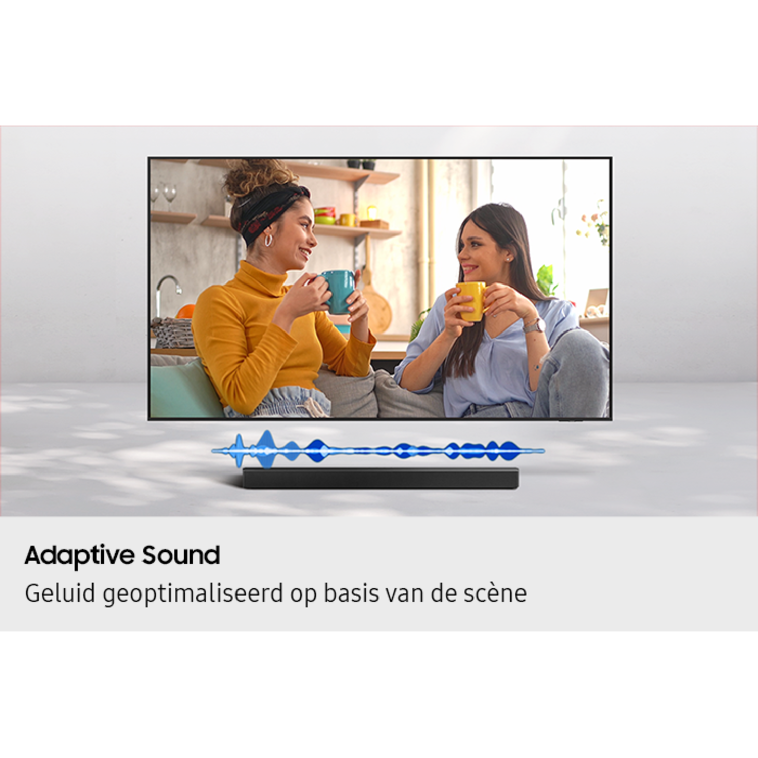 Two women watching TV, soundbar below. Adaptive Sound is written at the bottom.