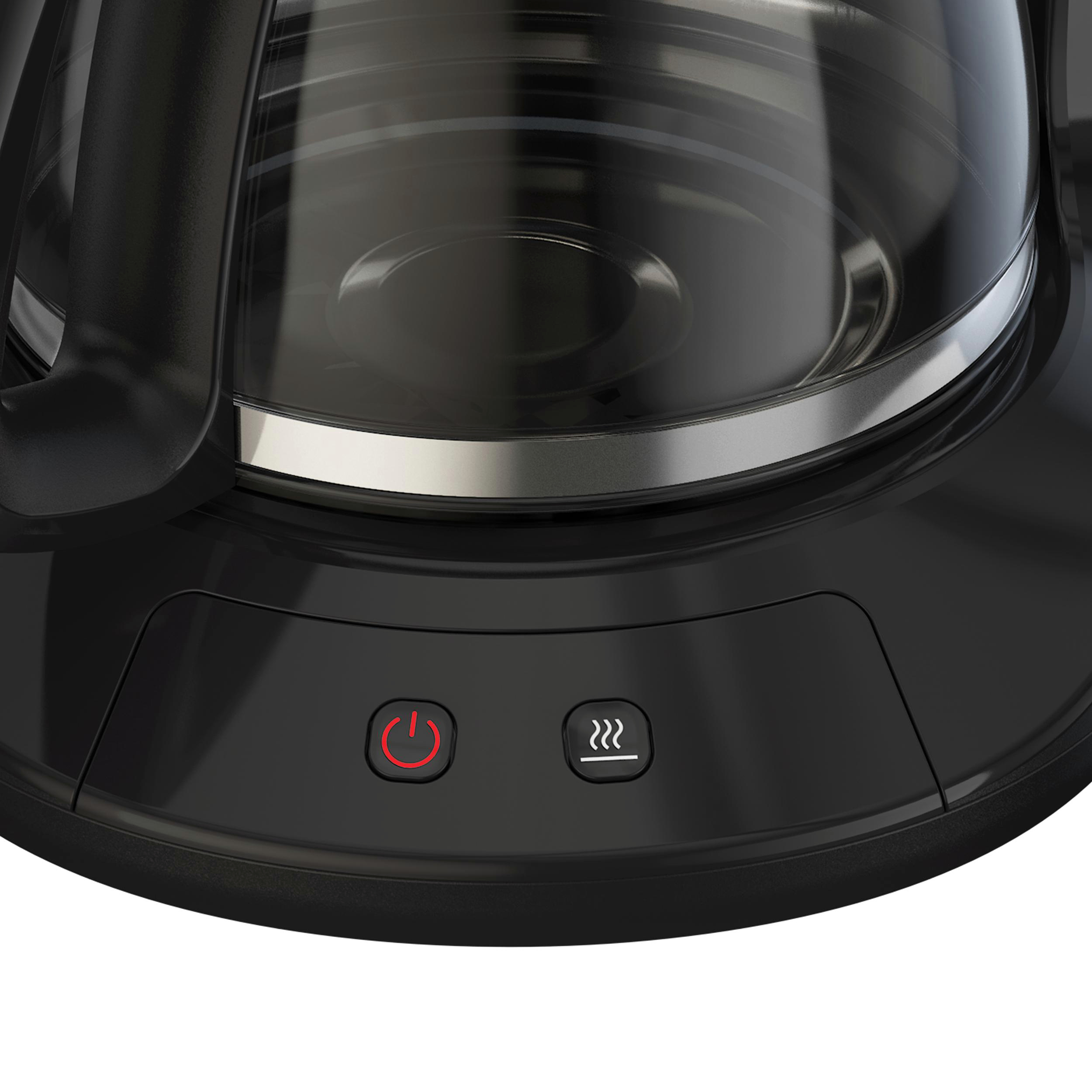 Nahaufnahme des Bodens einer schwarzen Kaffeemaschine mit Ein- und Warmhalte-Tasten.